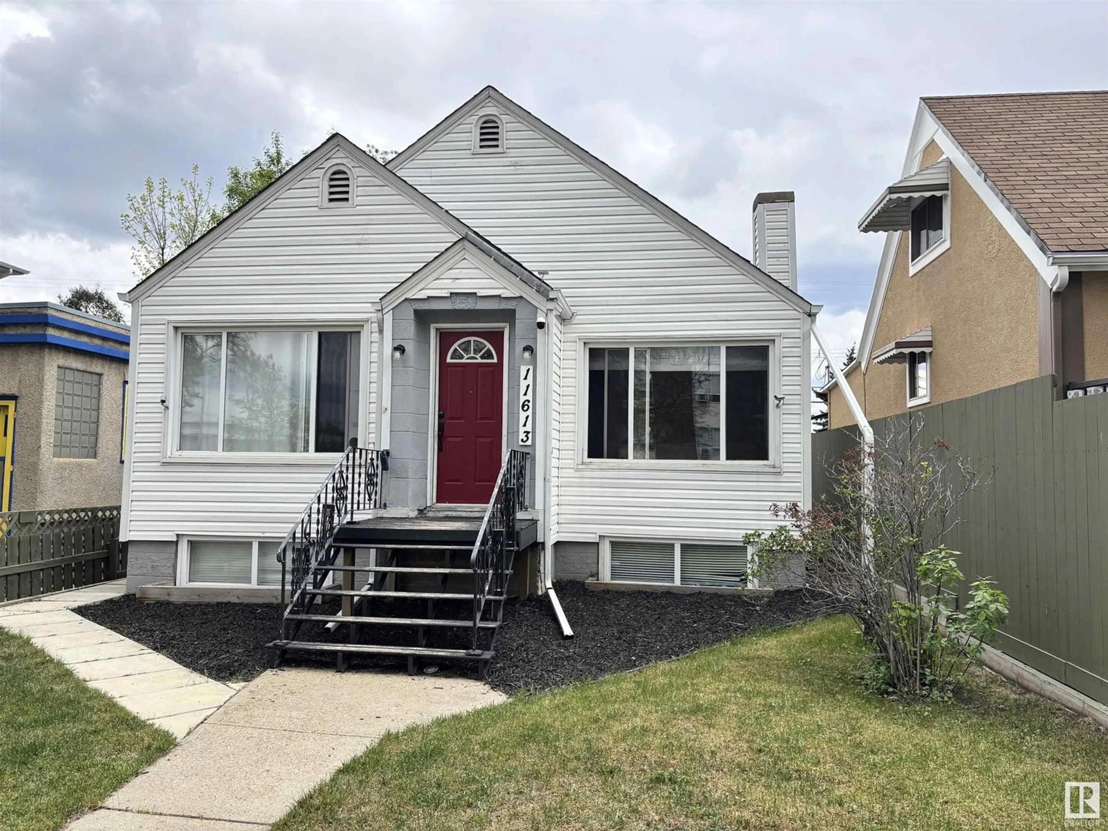 Home with vinyl exterior material, street for NW - 11613 81 ST, Edmonton Alberta T5B2S1