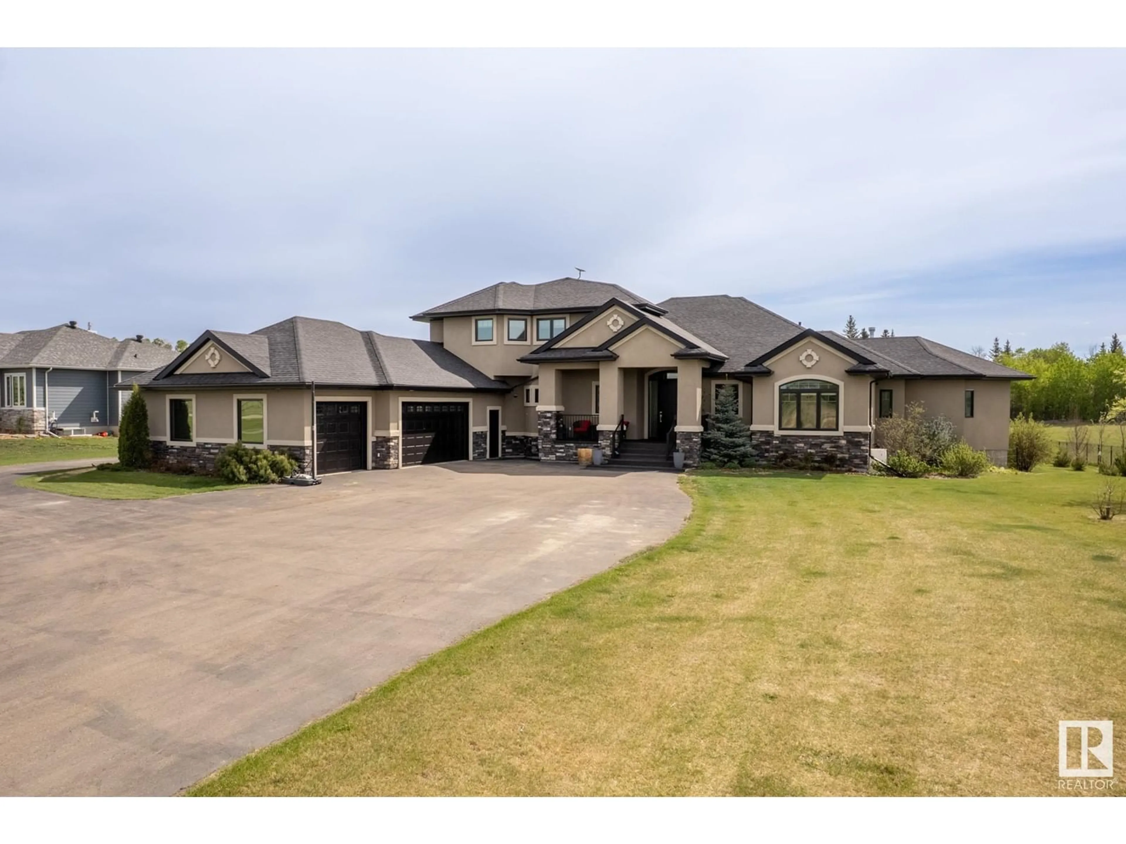 A pic from outside/outdoor area/front of a property/back of a property/a pic from drone, street for #15 - 27320 TWP ROAD 534, Rural Parkland County Alberta T7X3T1