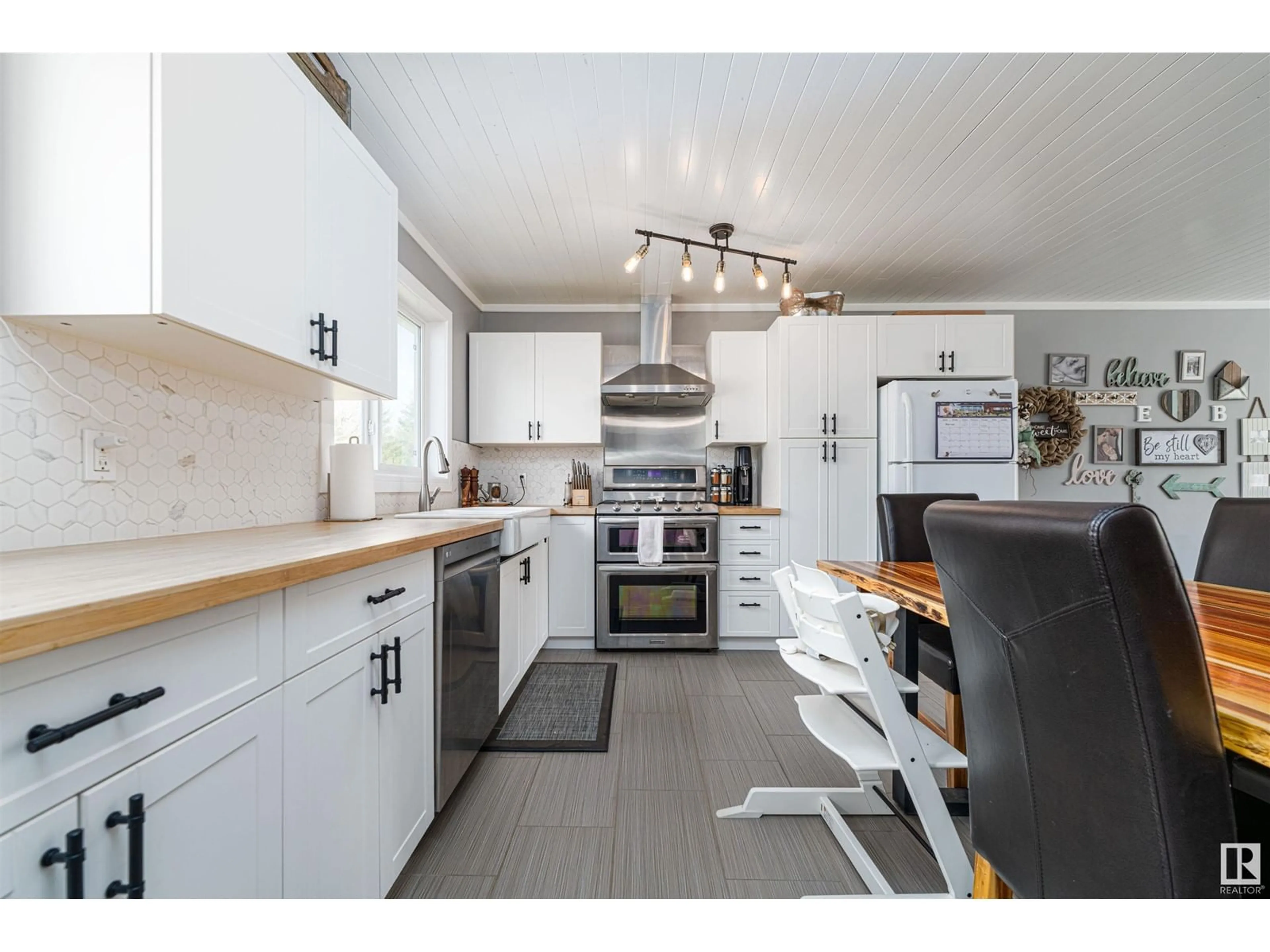 Open concept kitchen, wood/laminate floor for 21 - 52343 RGE ROAD 211, Rural Strathcona County Alberta T8G1A6