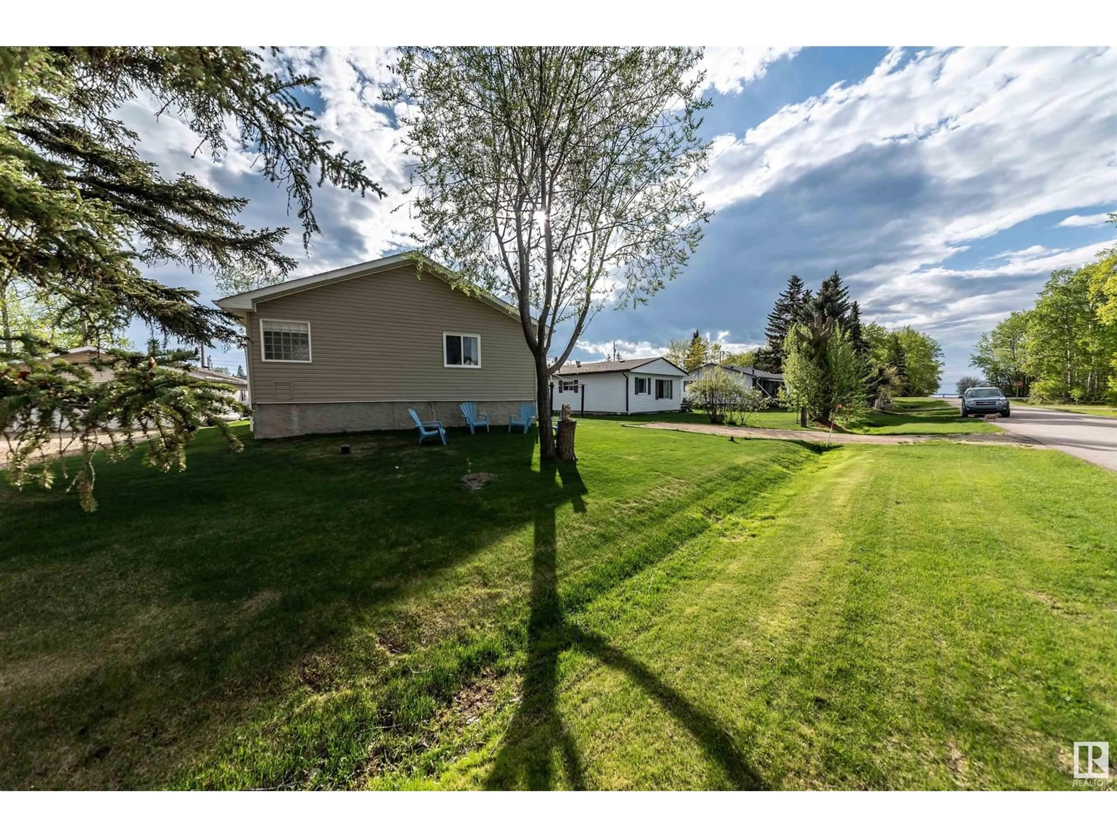 A pic from outside/outdoor area/front of a property/back of a property/a pic from drone, water/lake/river/ocean view for 4916 56 ST, Rural Lac Ste. Anne County Alberta T0E0A0