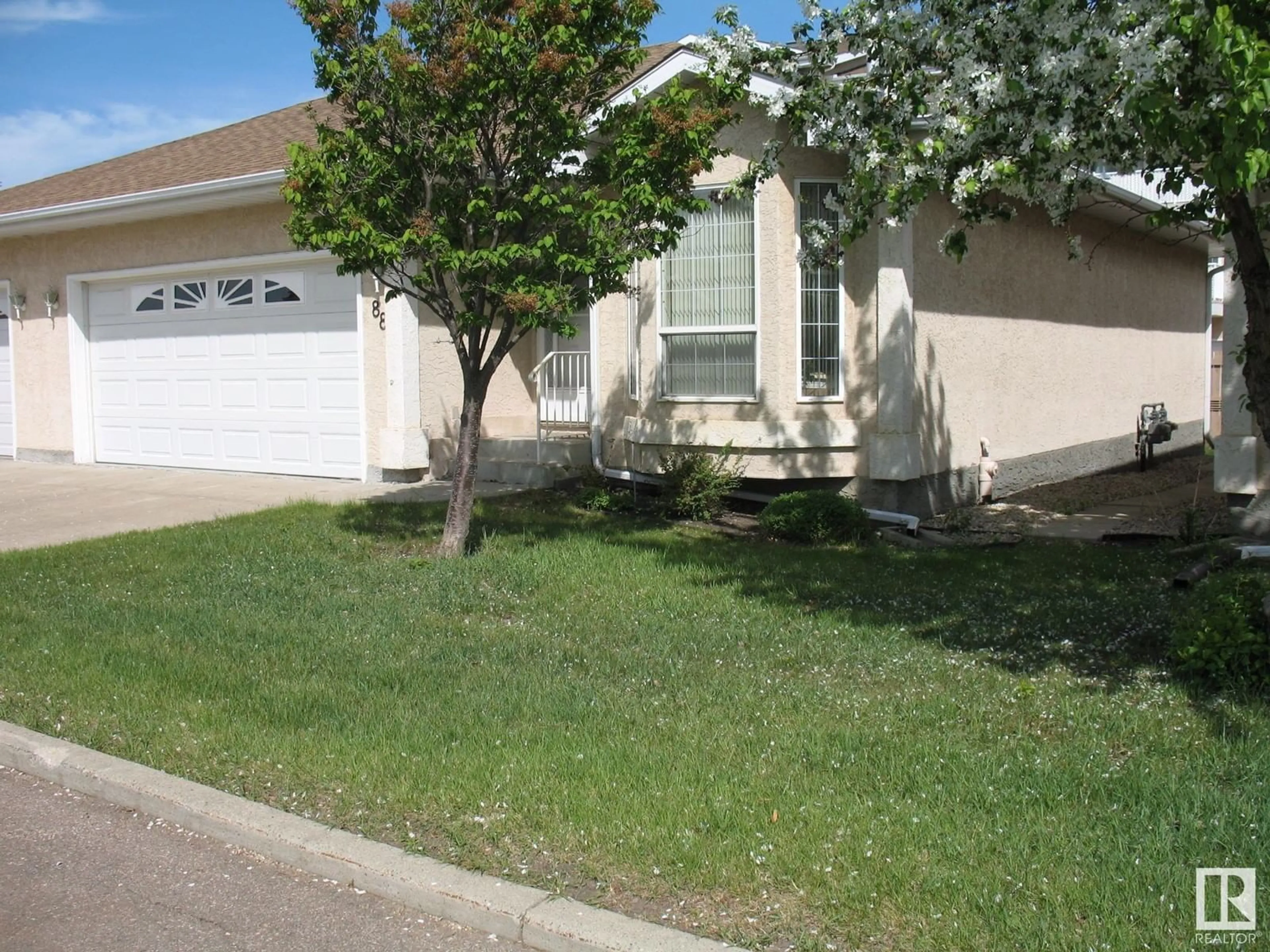 Home with vinyl exterior material, street for #88 - 13320 124 ST, Edmonton Alberta T5L5B7