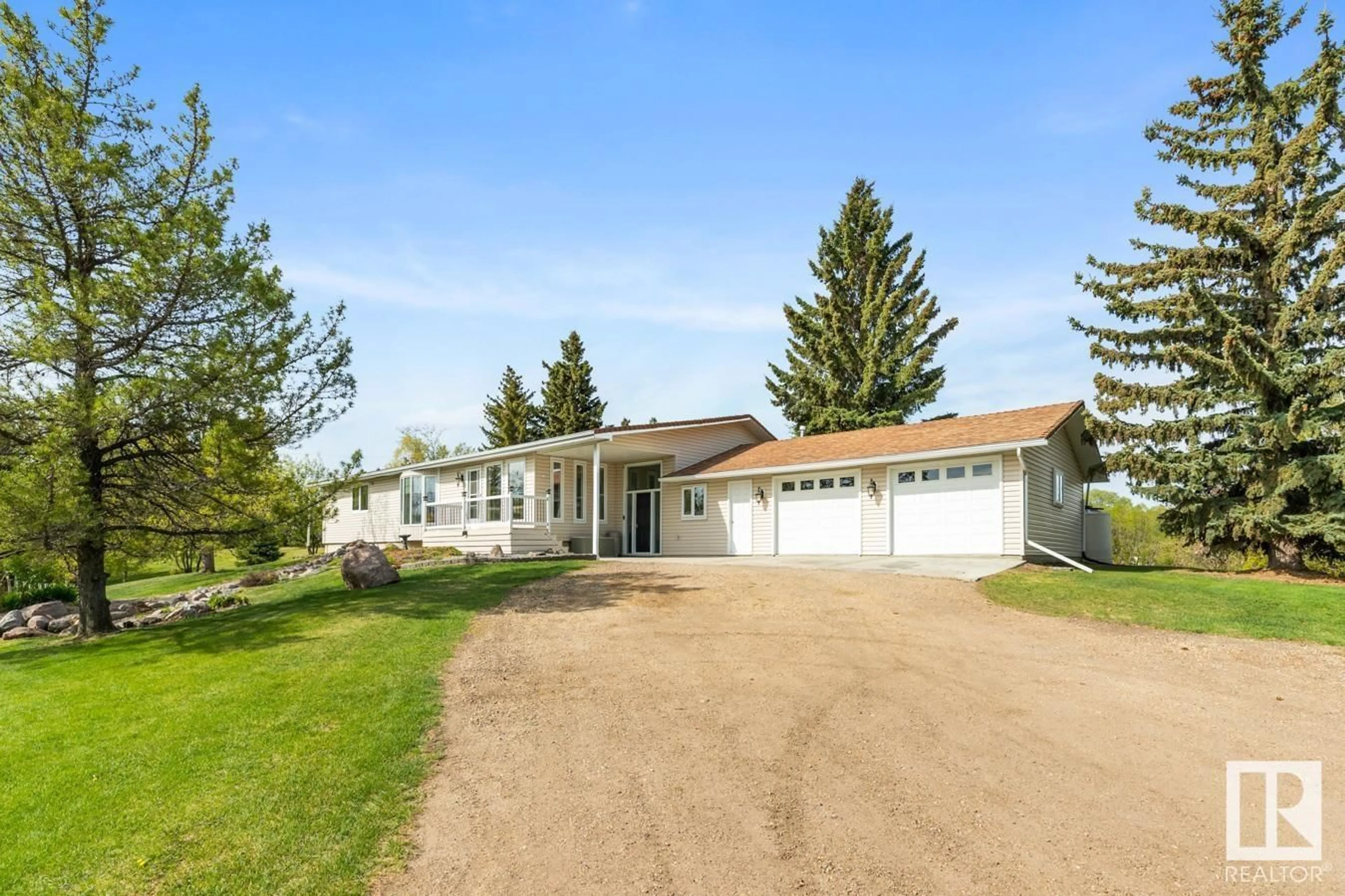 A pic from outside/outdoor area/front of a property/back of a property/a pic from drone, street for #14 - 22550 TWP ROAD 522, Rural Strathcona County Alberta T8C1G8