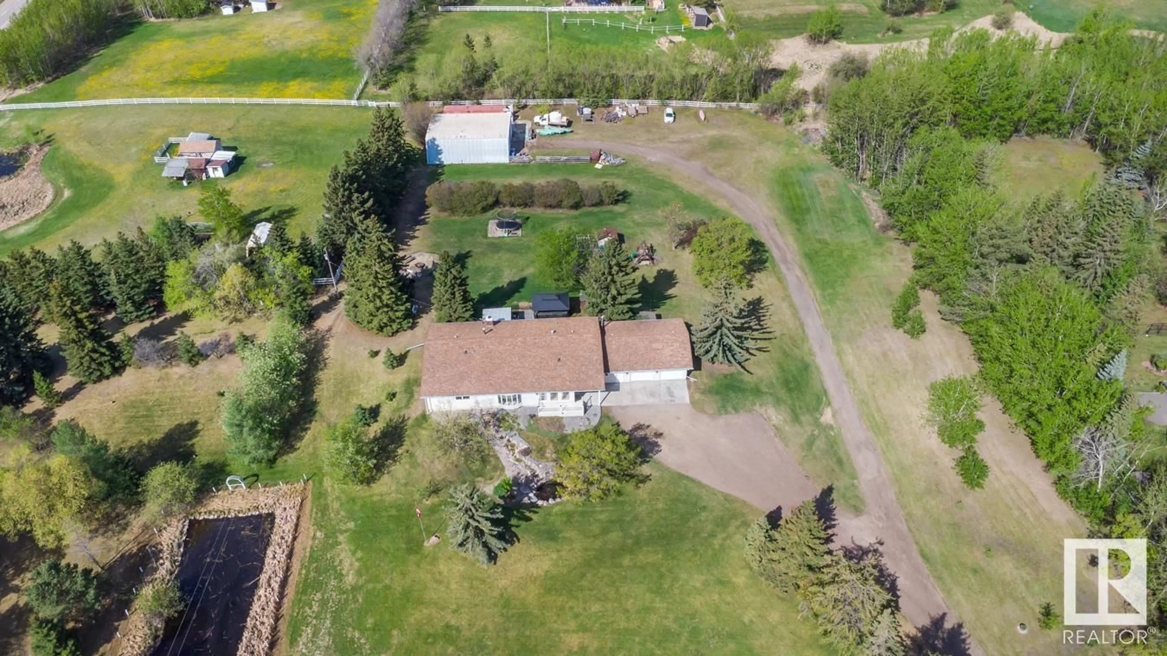 A pic from outside/outdoor area/front of a property/back of a property/a pic from drone, unknown for #14 - 22550 TWP ROAD 522, Rural Strathcona County Alberta T8C1G8