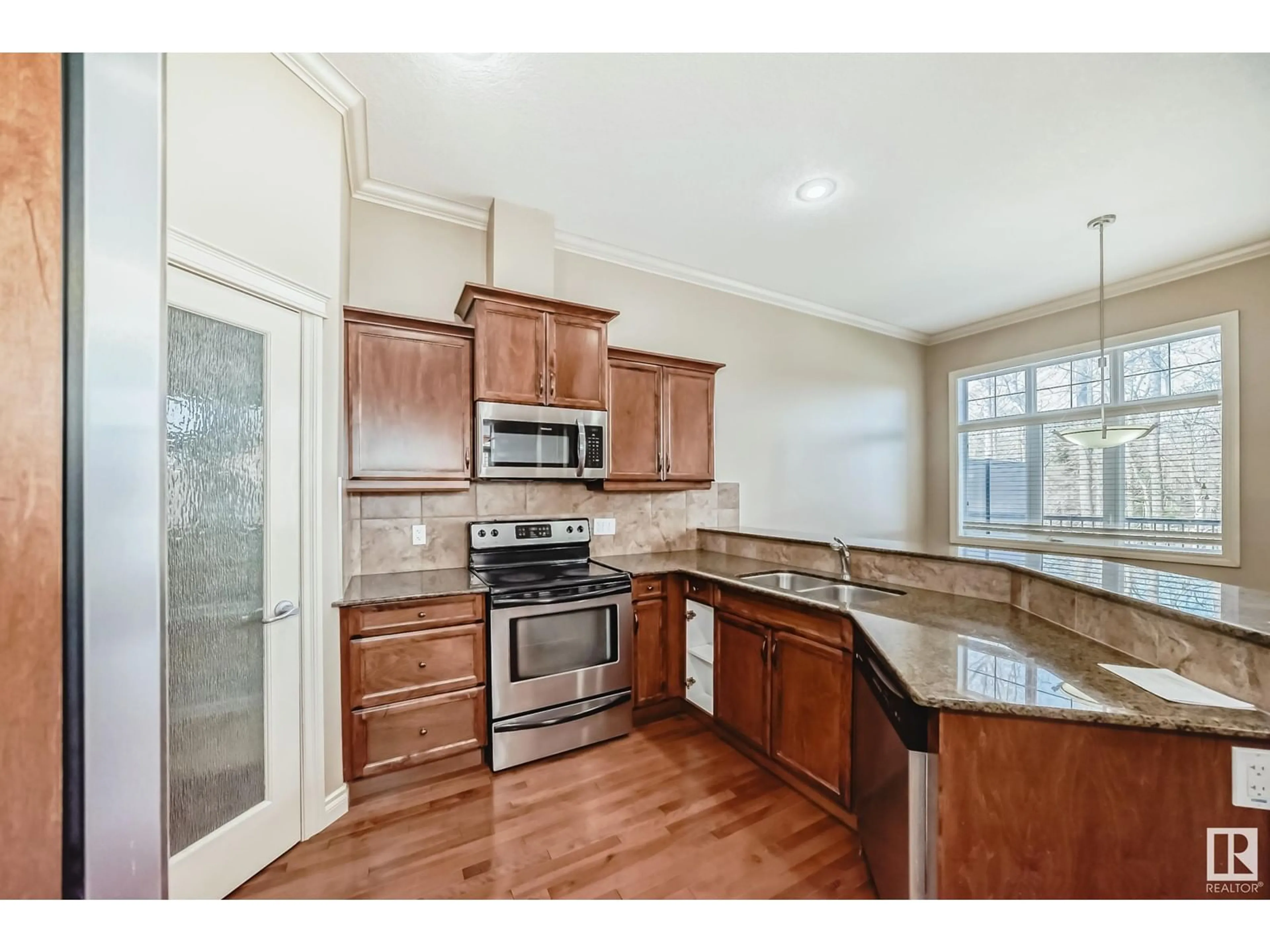 Open concept kitchen, ceramic/tile floor for #13 - 12610 15 AV, Edmonton Alberta T6W1X1