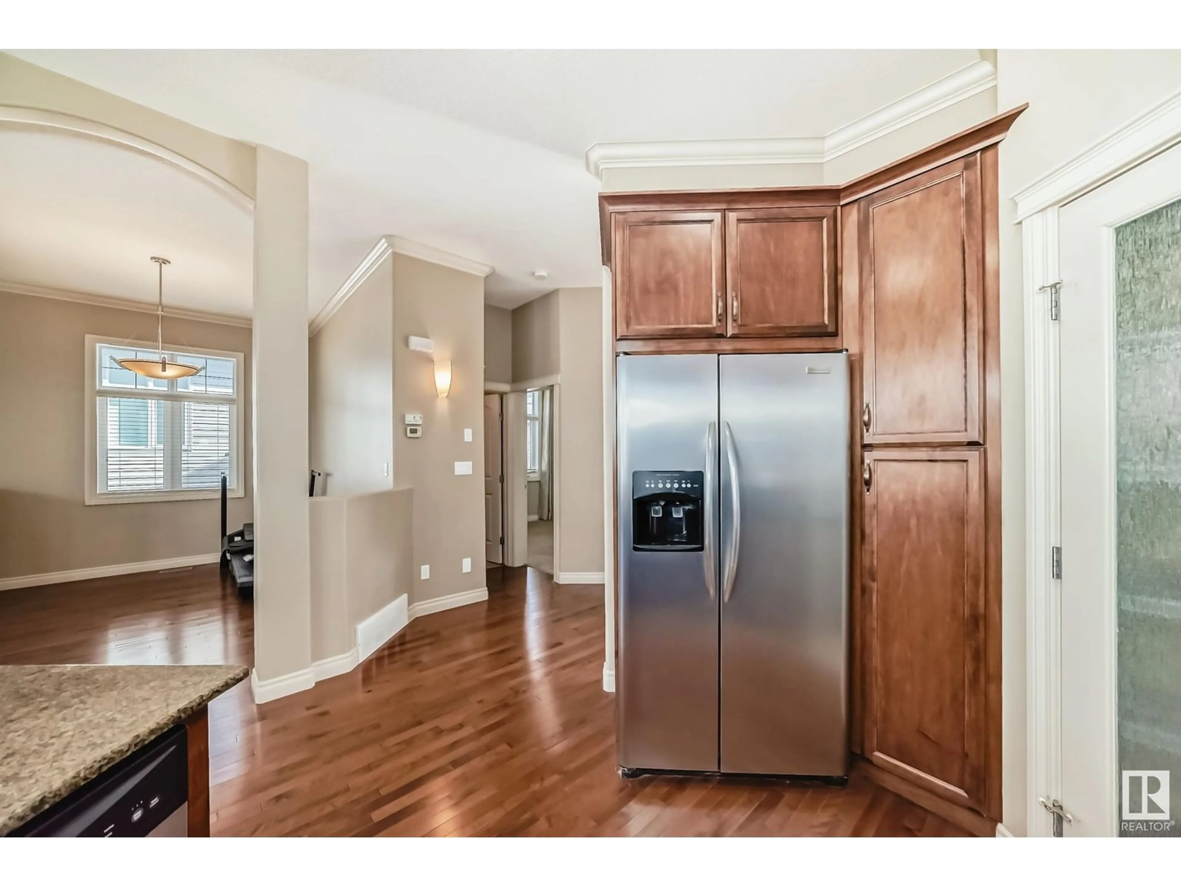 Open concept kitchen, wood/laminate floor for #13 - 12610 15 AV, Edmonton Alberta T6W1X1
