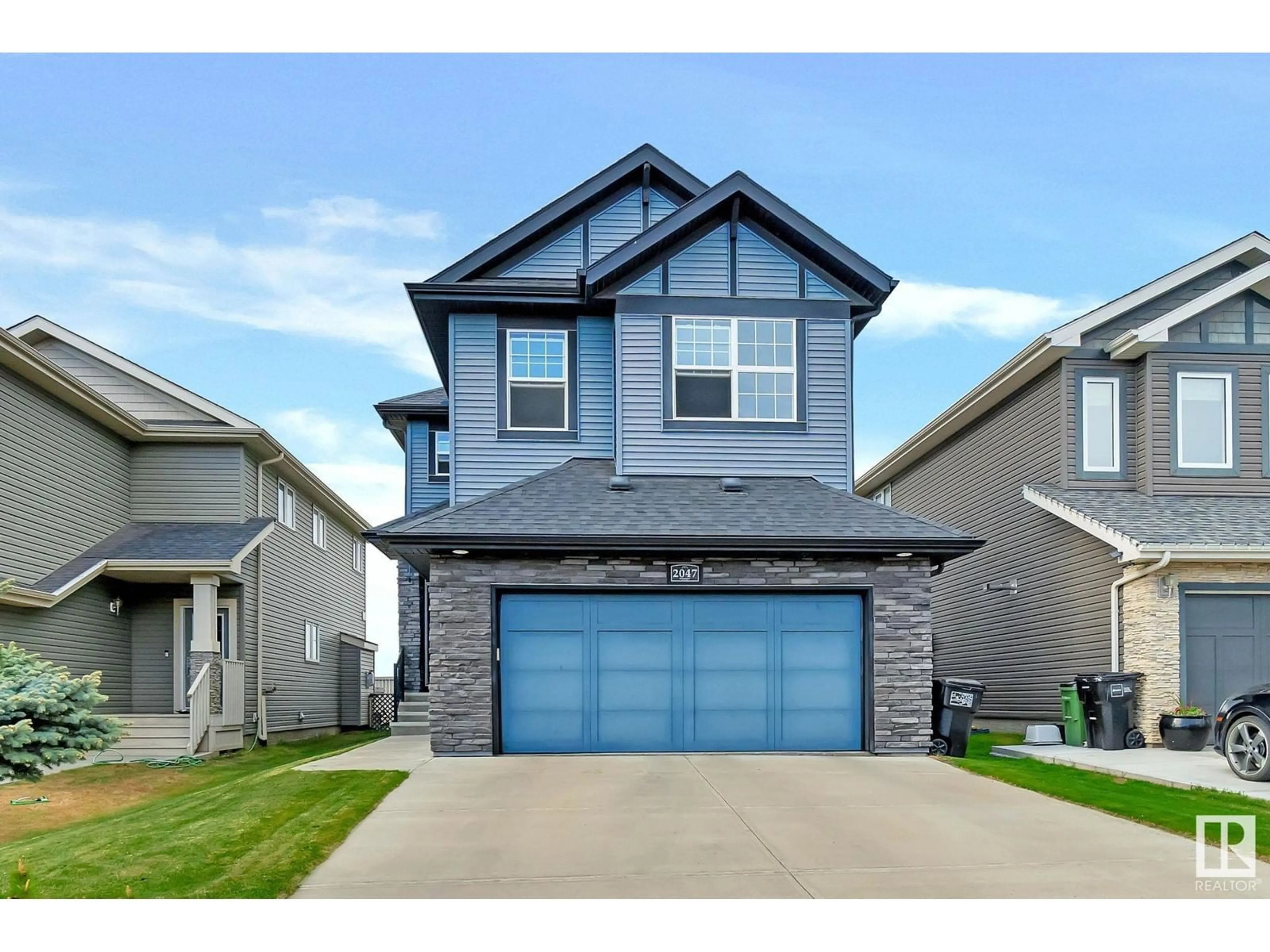 Home with vinyl exterior material, street for 2047 REDTAIL CM, Edmonton Alberta T5S0H3
