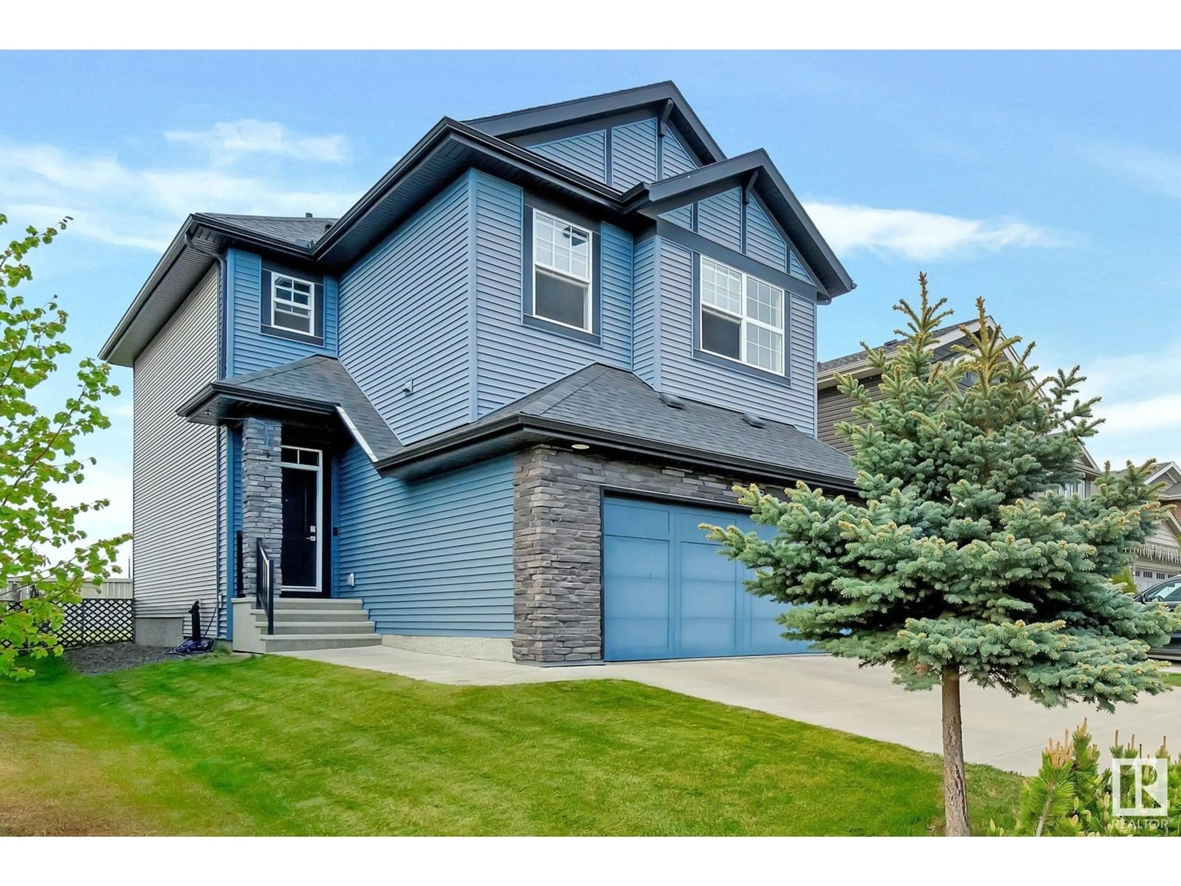 Home with vinyl exterior material, street for 2047 REDTAIL CM, Edmonton Alberta T5S0H3