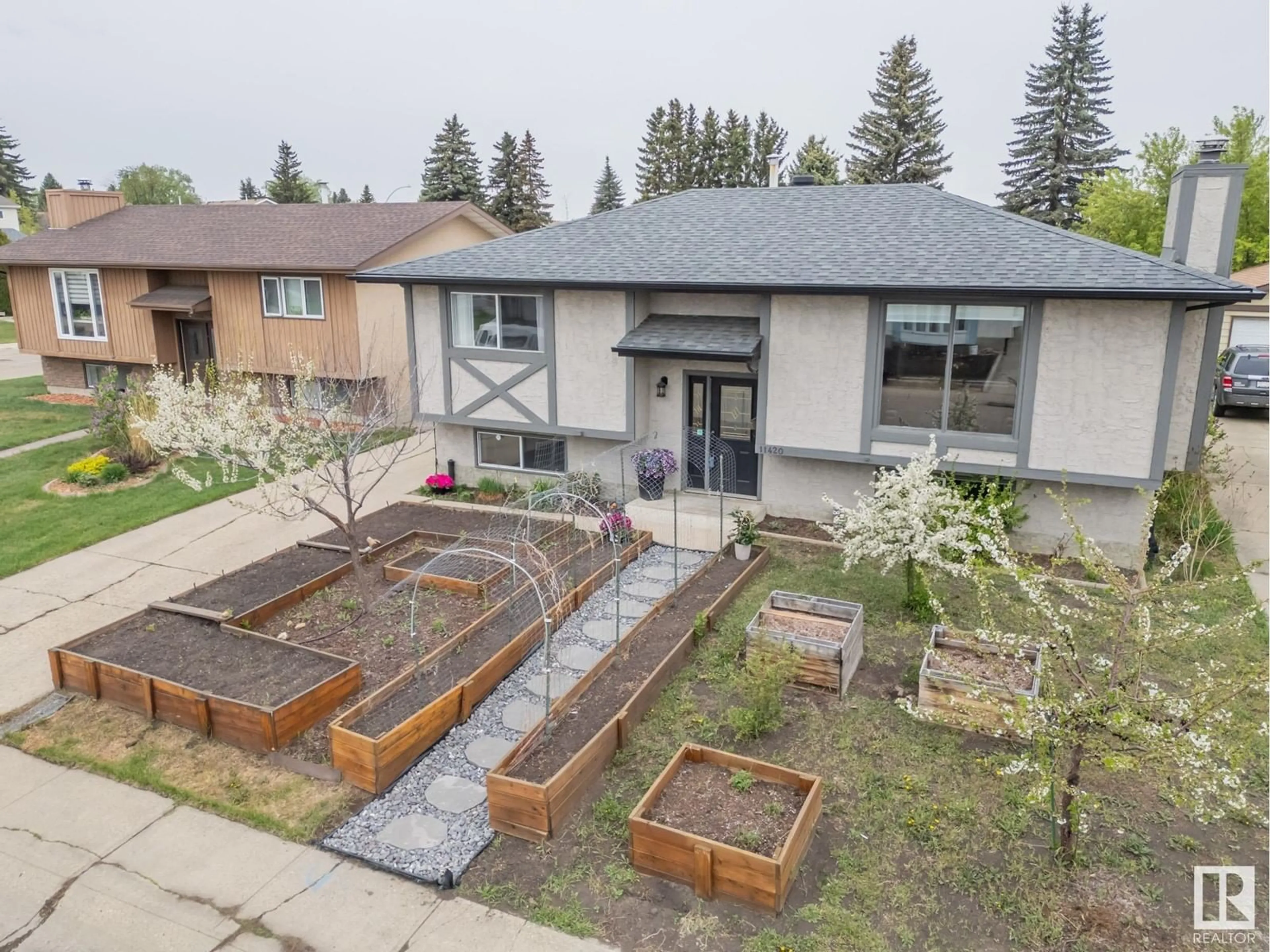 A pic from outside/outdoor area/front of a property/back of a property/a pic from drone, street for 11420 164 AV, Edmonton Alberta T5X3W2