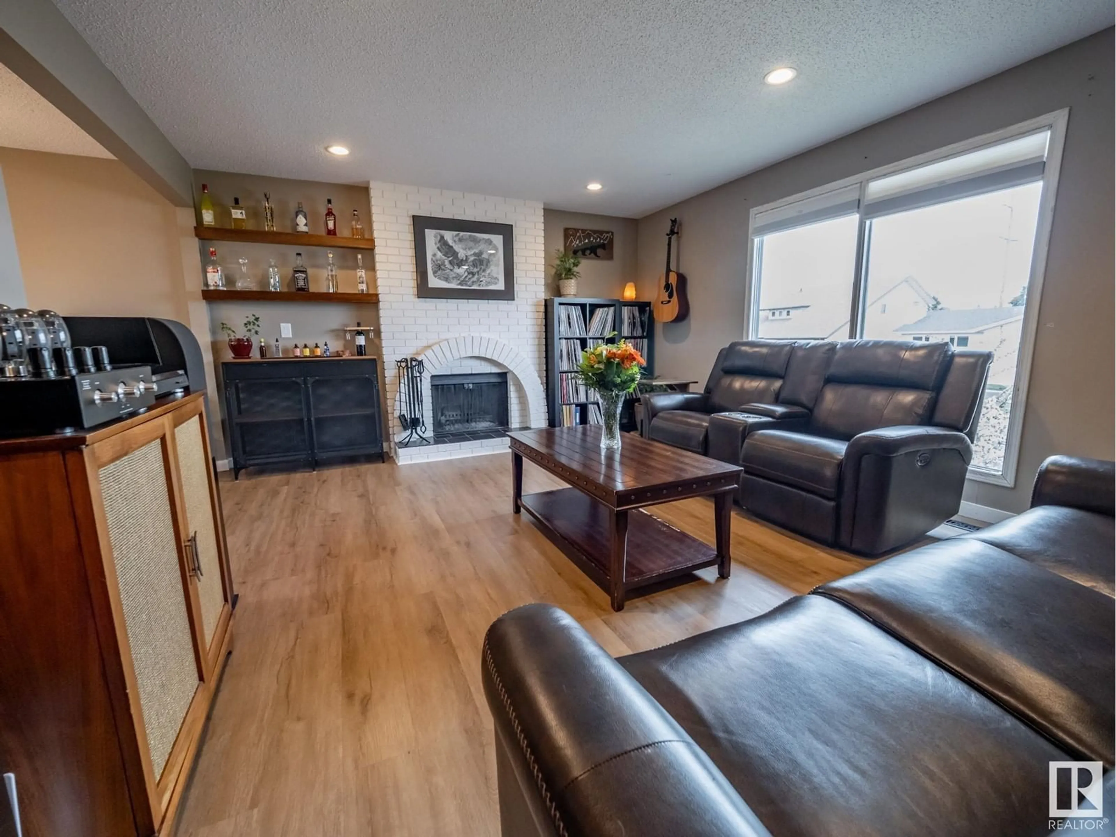 Living room with furniture, wood/laminate floor for 11420 164 AV, Edmonton Alberta T5X3W2