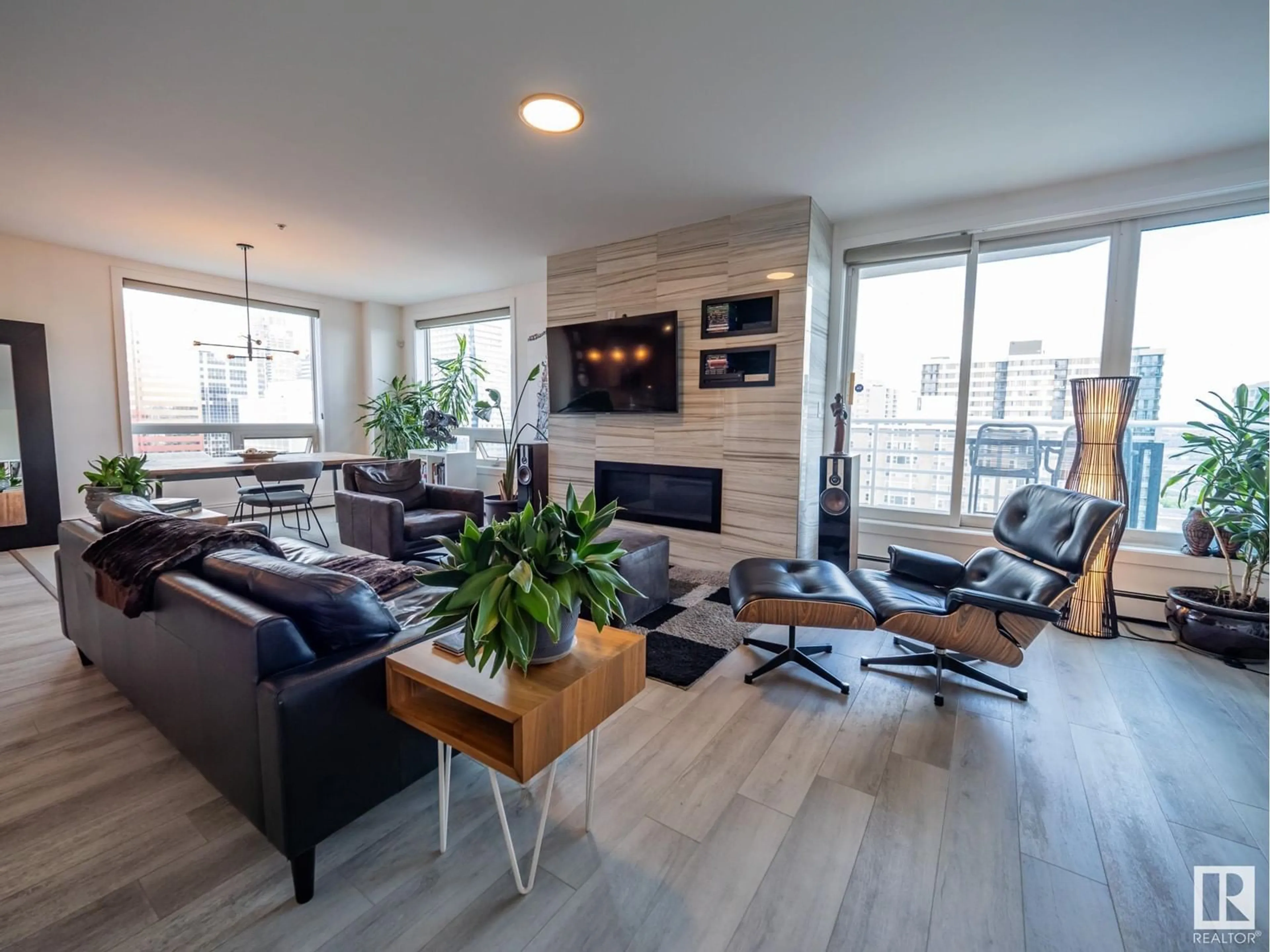 Living room with furniture, wood/laminate floor for 10504 - 1401 99 AV, Edmonton Alberta T5K1B2