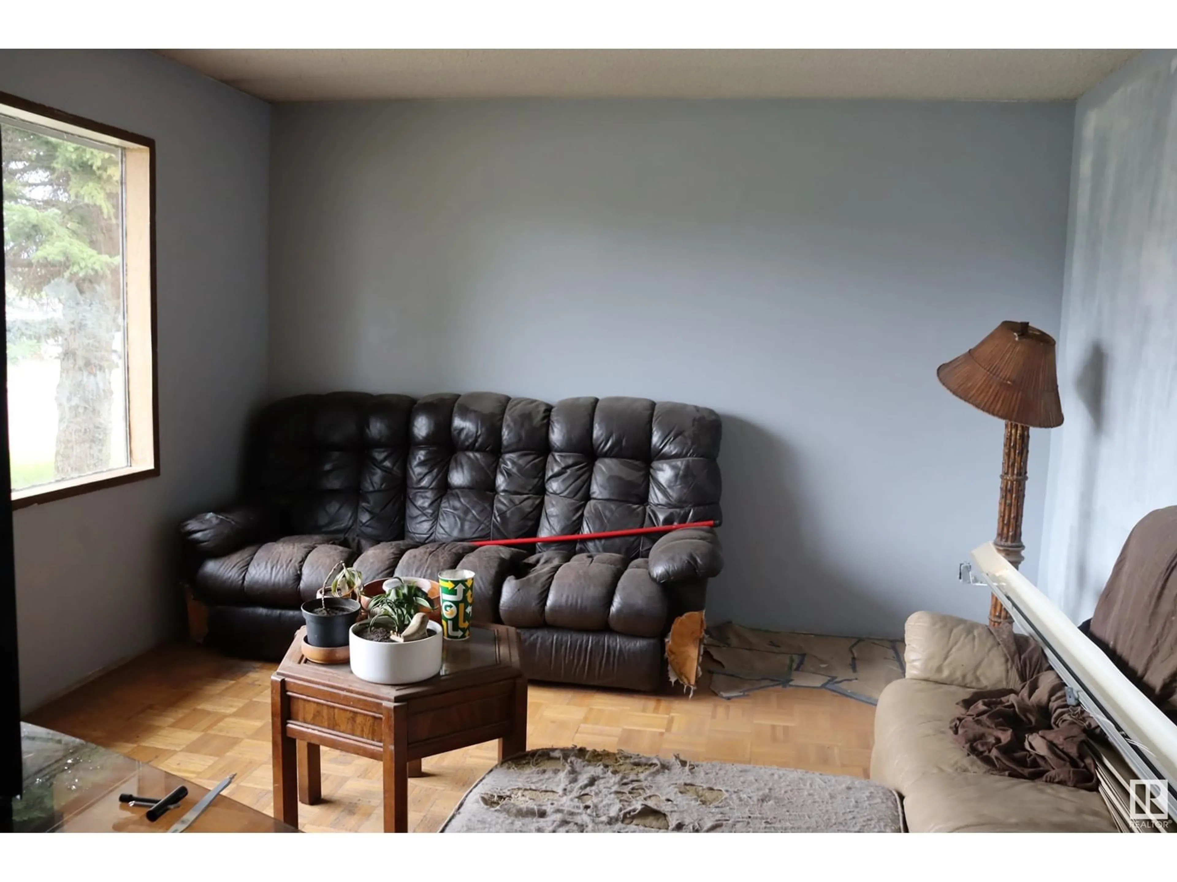 Living room with furniture, wood/laminate floor for 6106 51ST, Ponoka Alberta T4J1E6