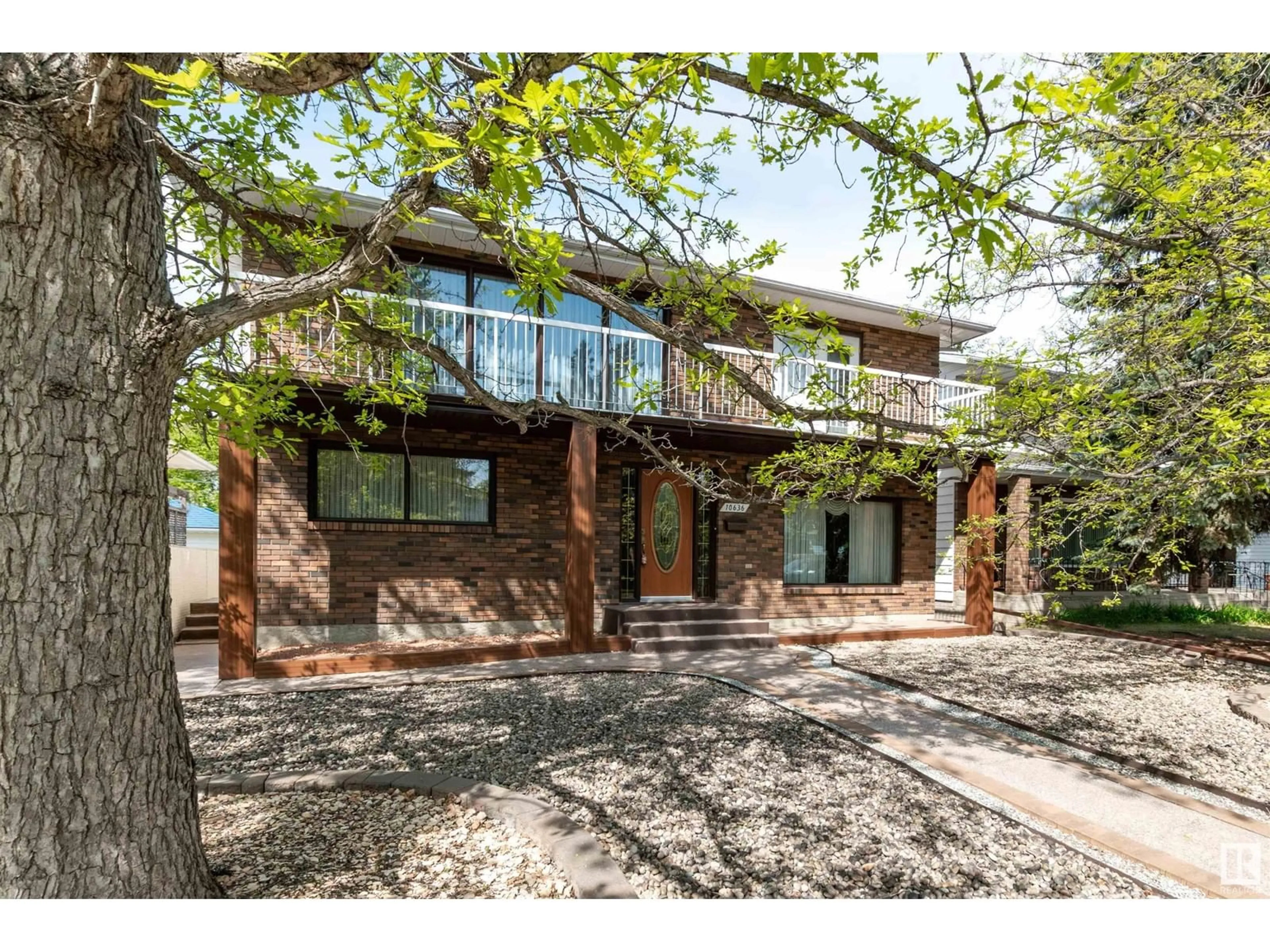 Home with brick exterior material, street for NW - 10636 80 ST, Edmonton Alberta T6A3K1