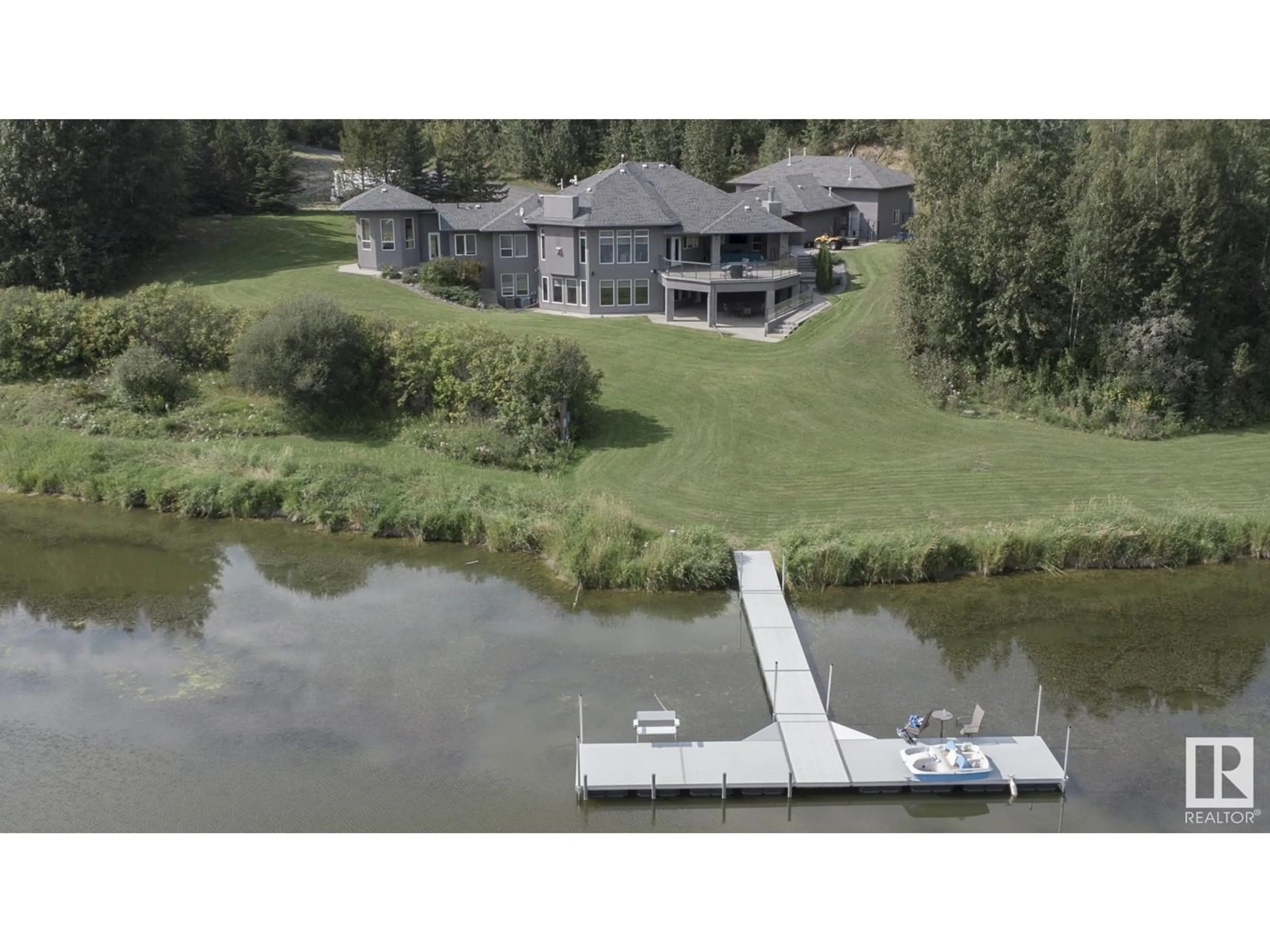 A pic from outside/outdoor area/front of a property/back of a property/a pic from drone, water/lake/river/ocean view for 53417 RGE RD 15, Rural Parkland County Alberta T7Y3H0