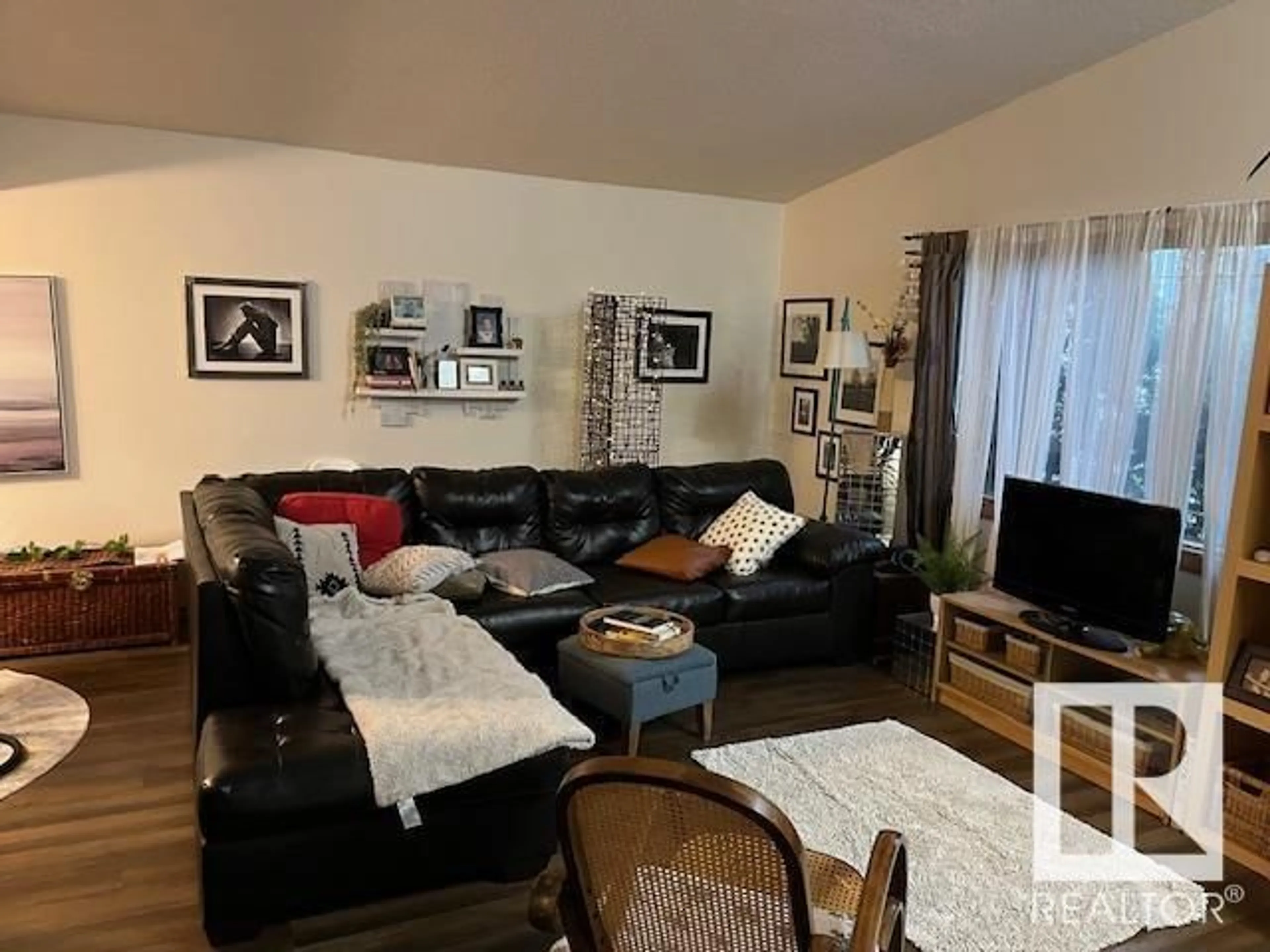 Living room with furniture, wood/laminate floor for 16103 86 AV NW, Edmonton Alberta T6R4C6