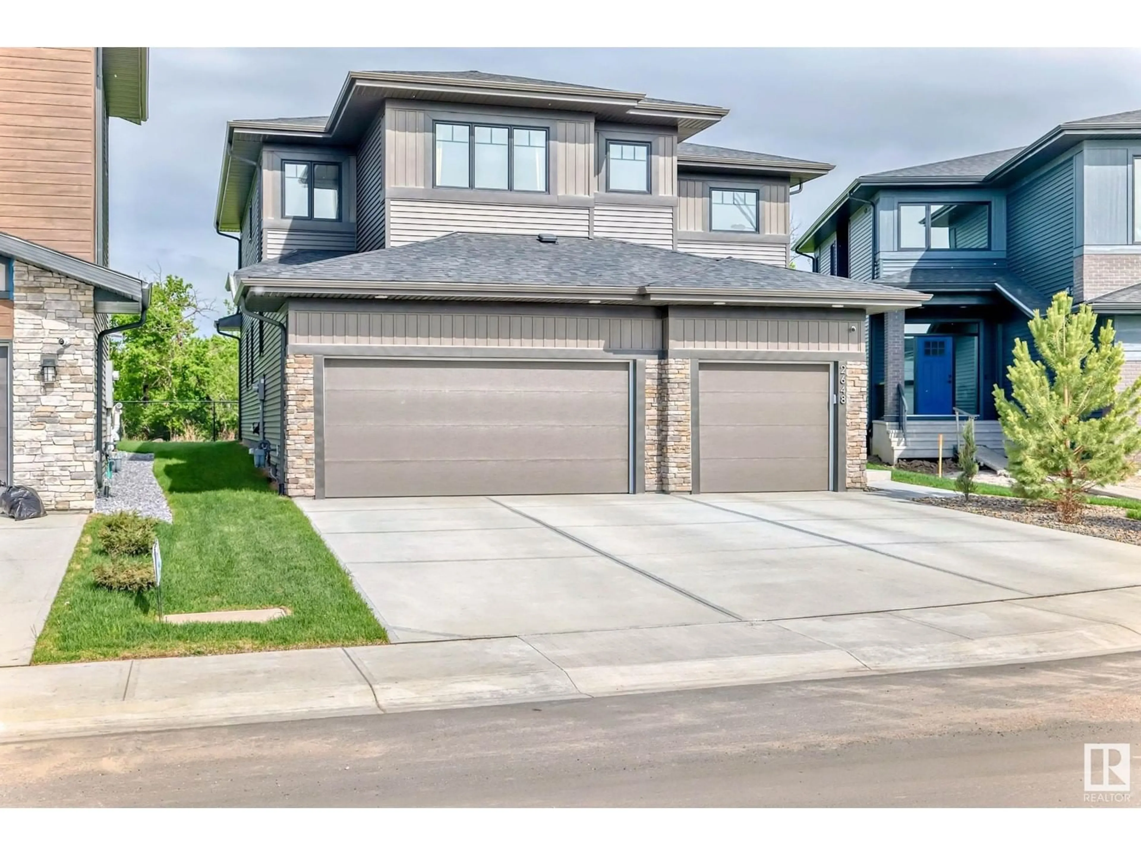 Home with brick exterior material, street for NW - 2648 208 ST, Edmonton Alberta T6M1P3
