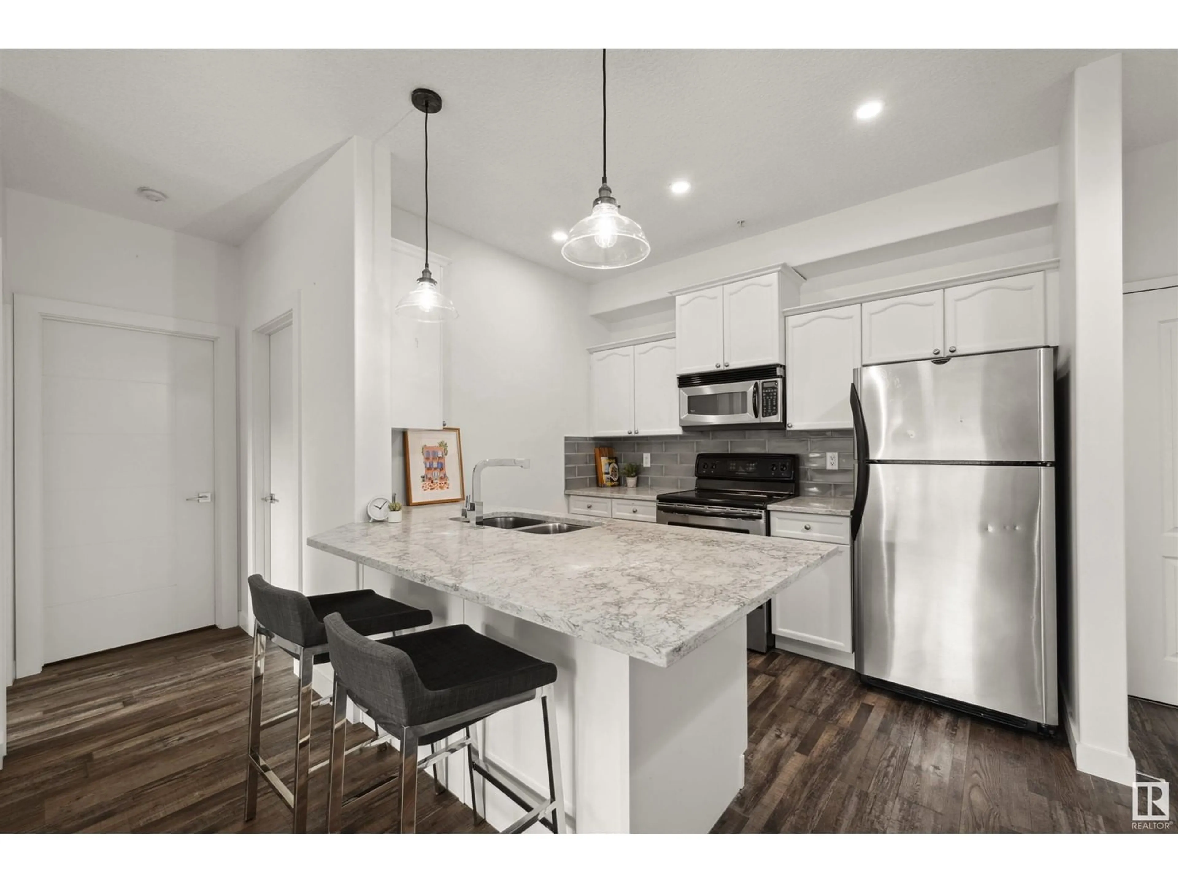 Open concept kitchen, unknown for #119 - 16807 100 AV, Edmonton Alberta T5P4Z6