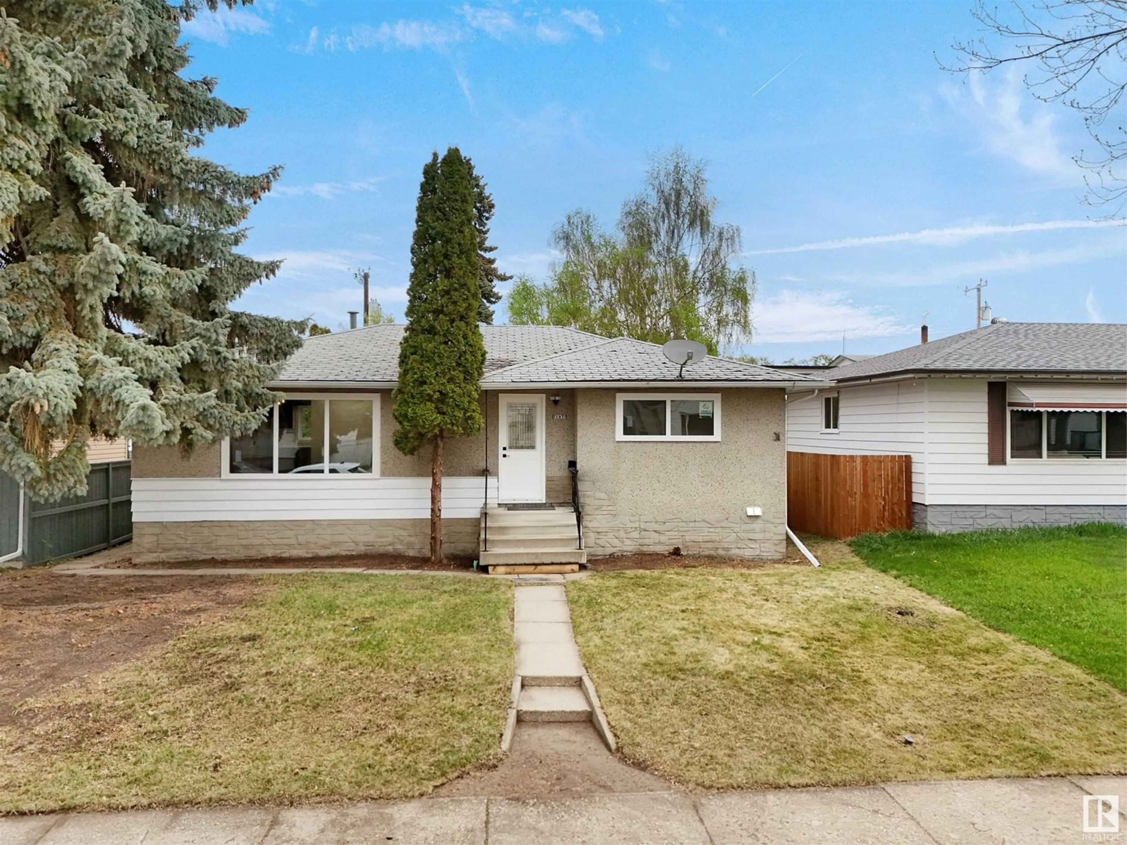 Home with vinyl exterior material, street for 4034 117 AV, Edmonton Alberta T5W0Y2