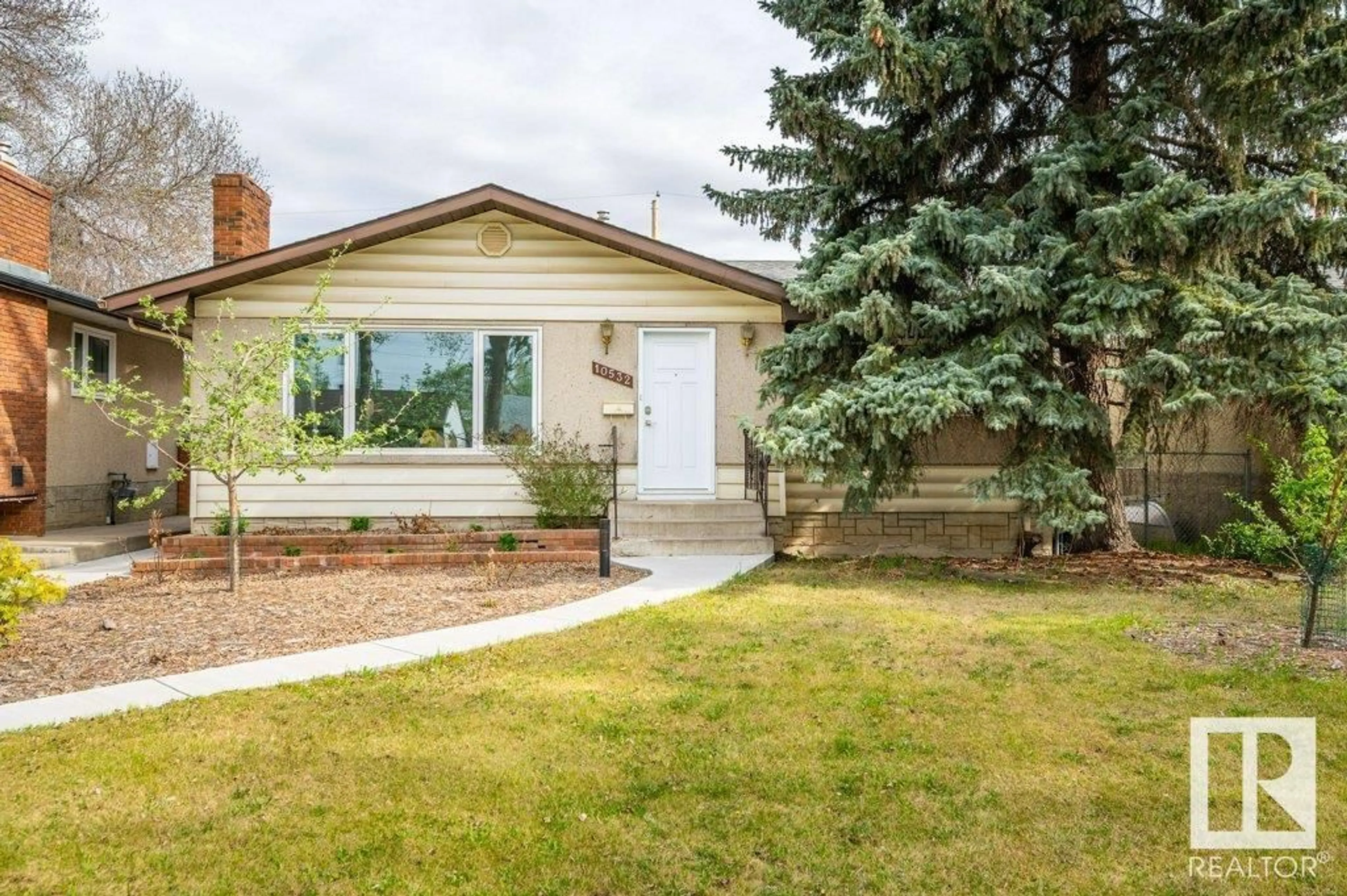 Home with brick exterior material, street for 10532 128 AV, Edmonton Alberta T5E0J3