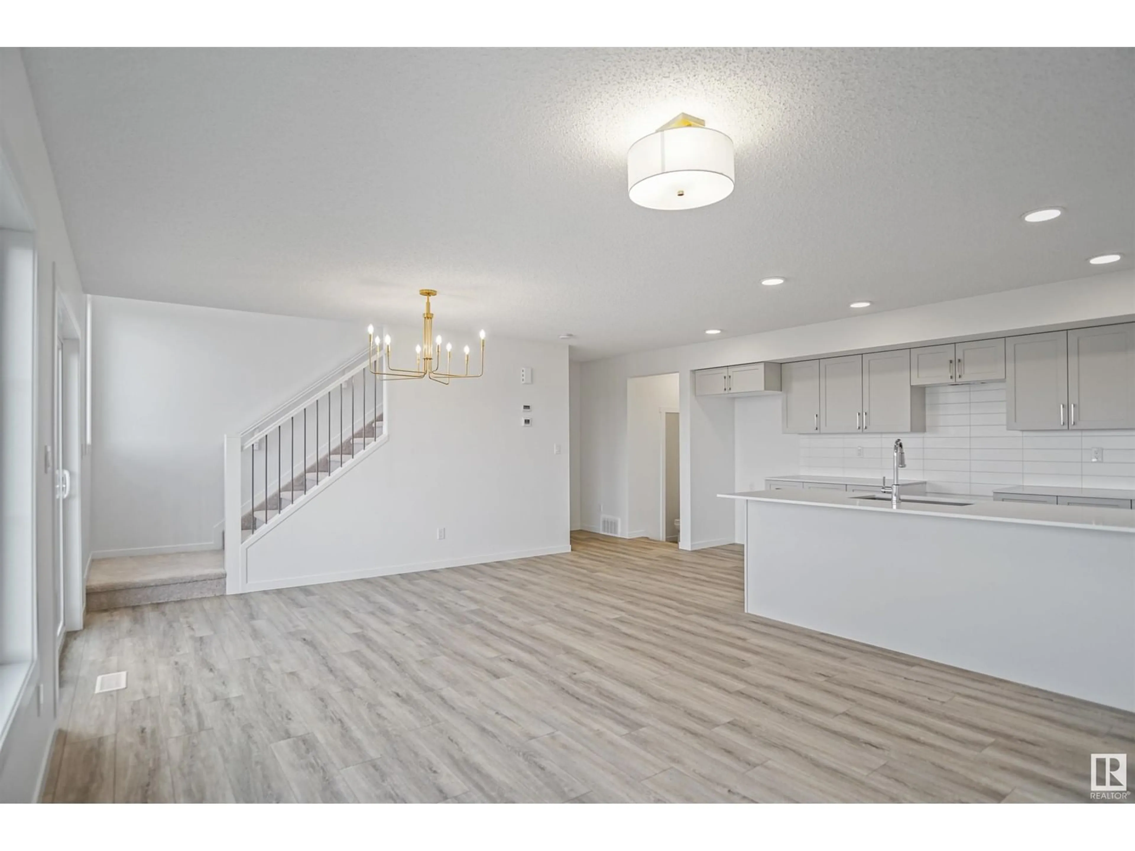 Open concept kitchen, wood/laminate floor for 54 19904 31 AV NW, Edmonton Alberta T6M1N7