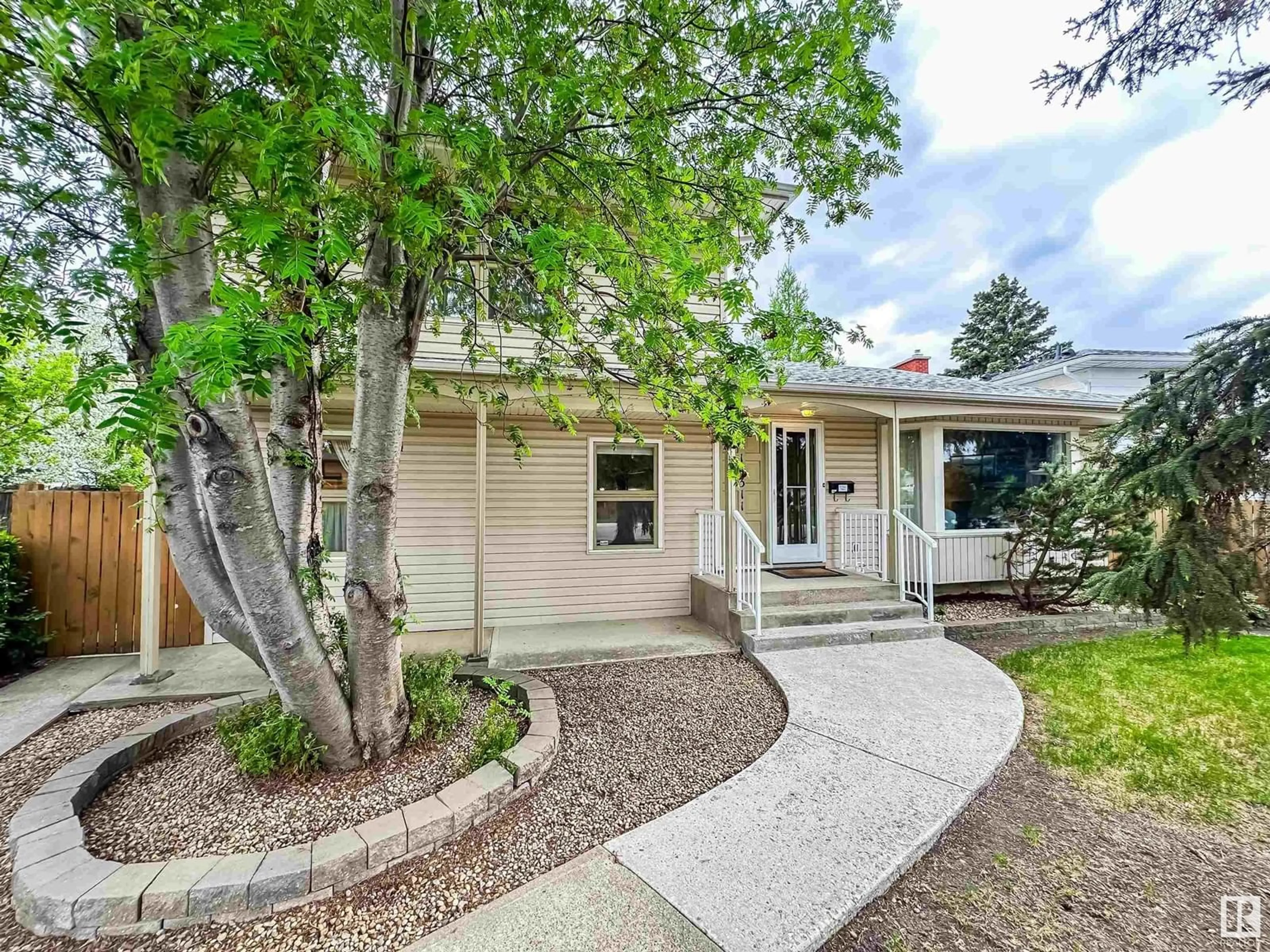 Home with vinyl exterior material, street for 14311 58 AV, Edmonton Alberta T6H1C9