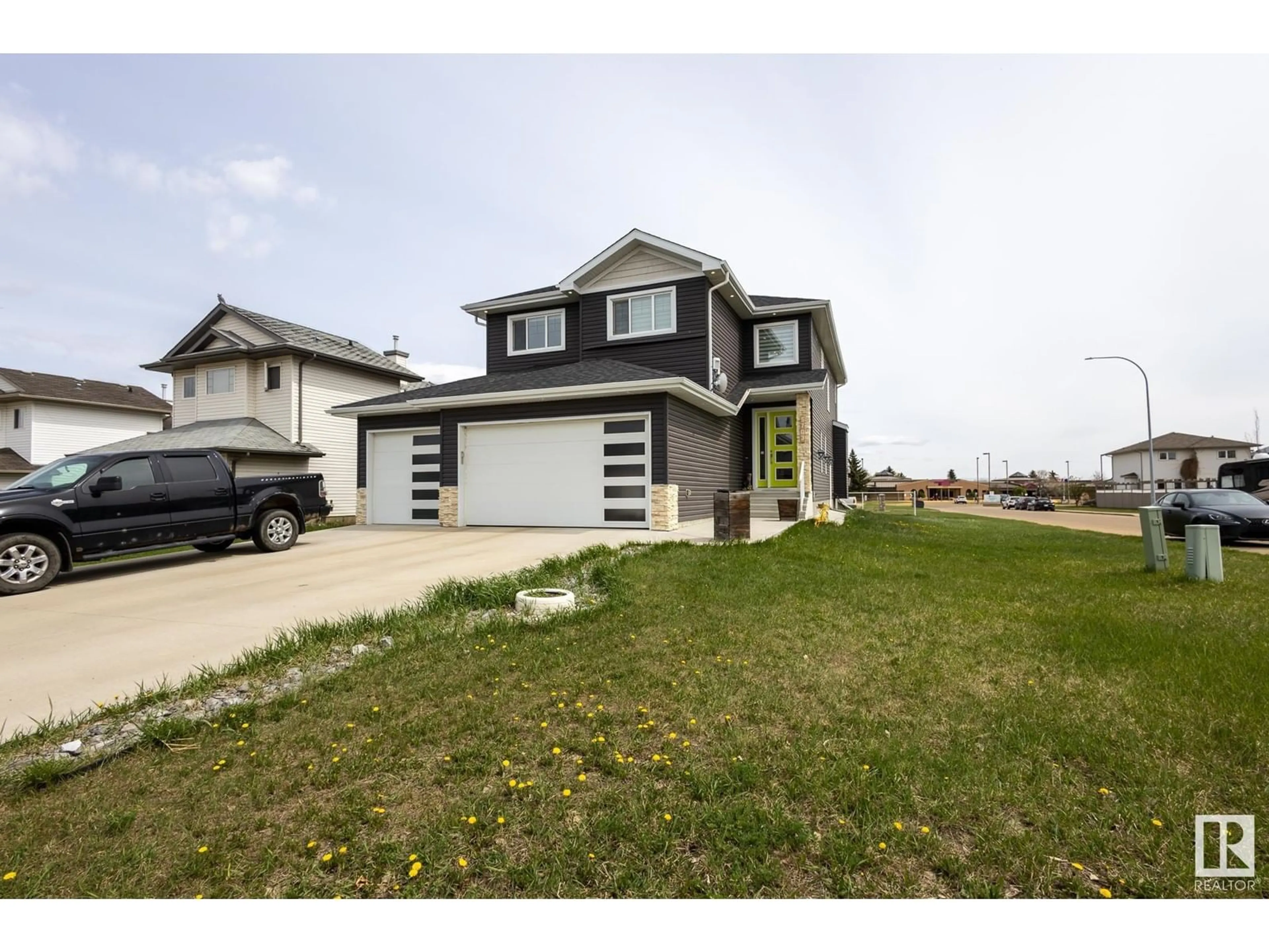 Home with vinyl exterior material, street for 5703 45 ST, Tofield Alberta T4V4Y2