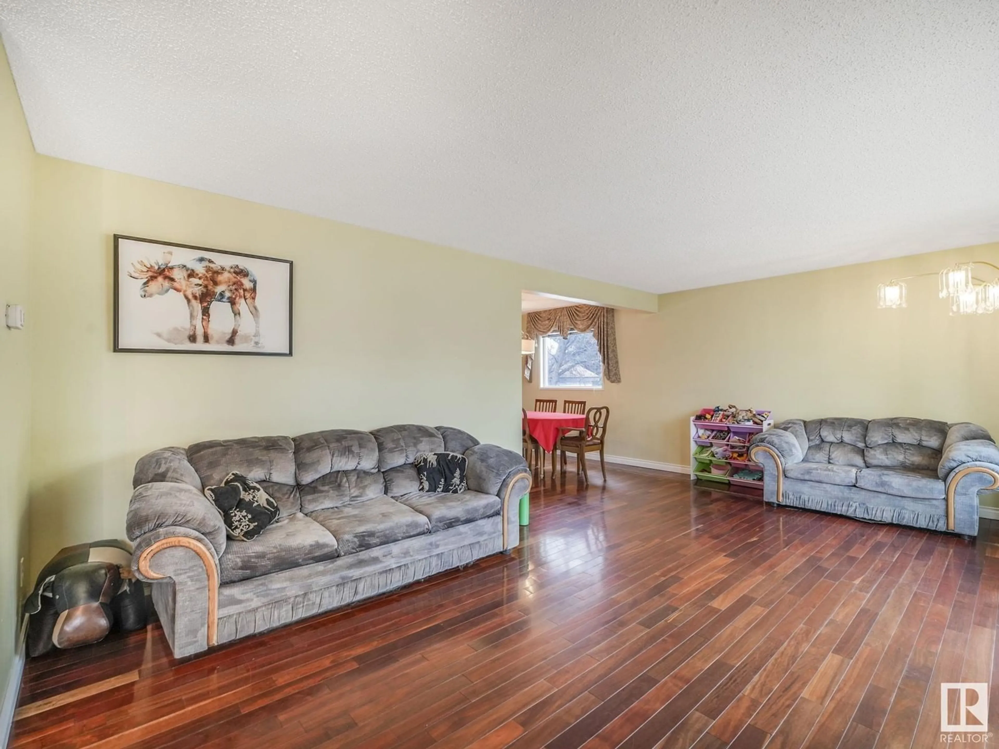 Living room with furniture, wood/laminate floor for NW - 18409 62B AV, Edmonton Alberta T5T2S9