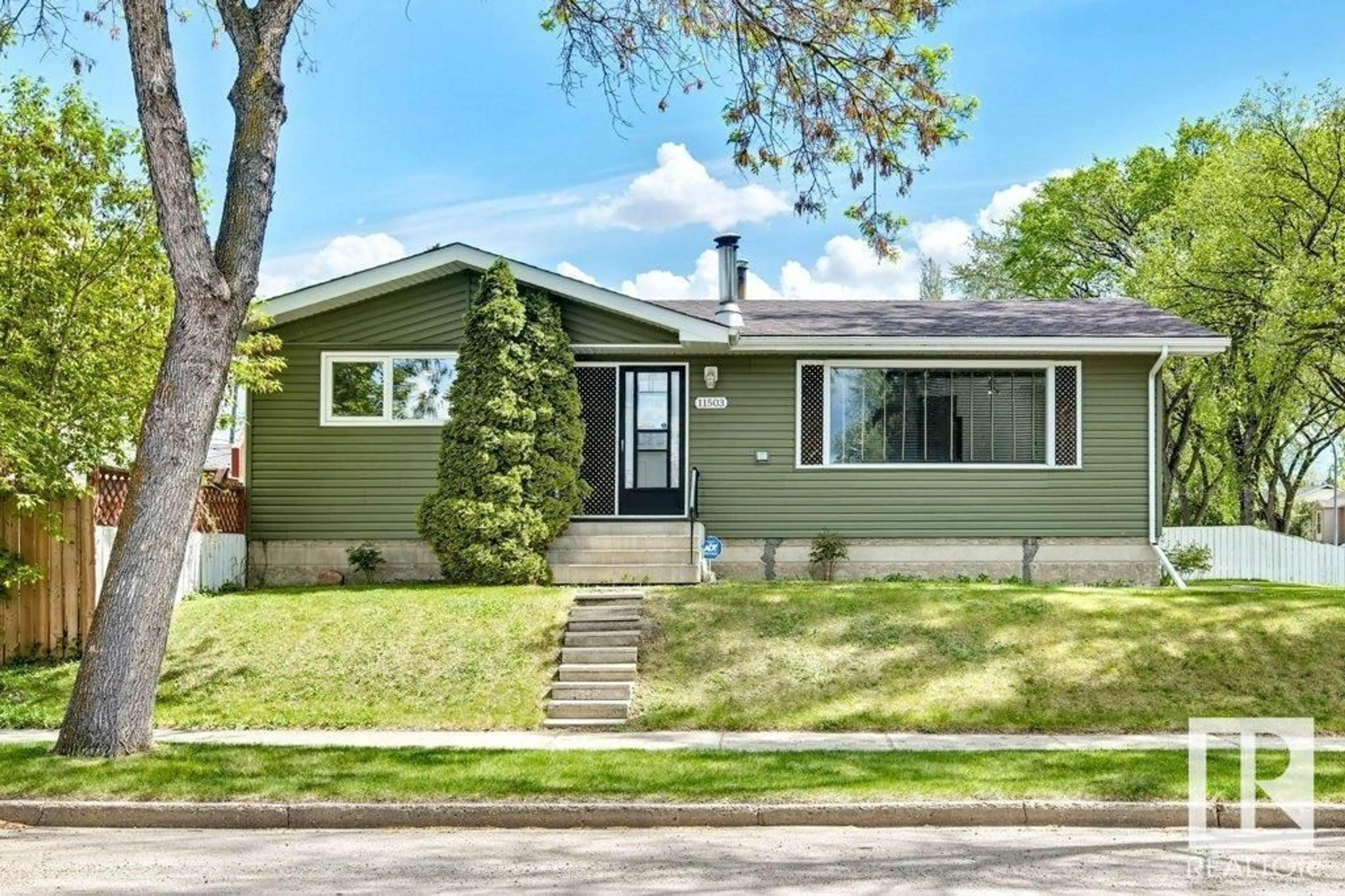 Home with vinyl exterior material, street for 11503 42 ST, Edmonton Alberta T5W2N1