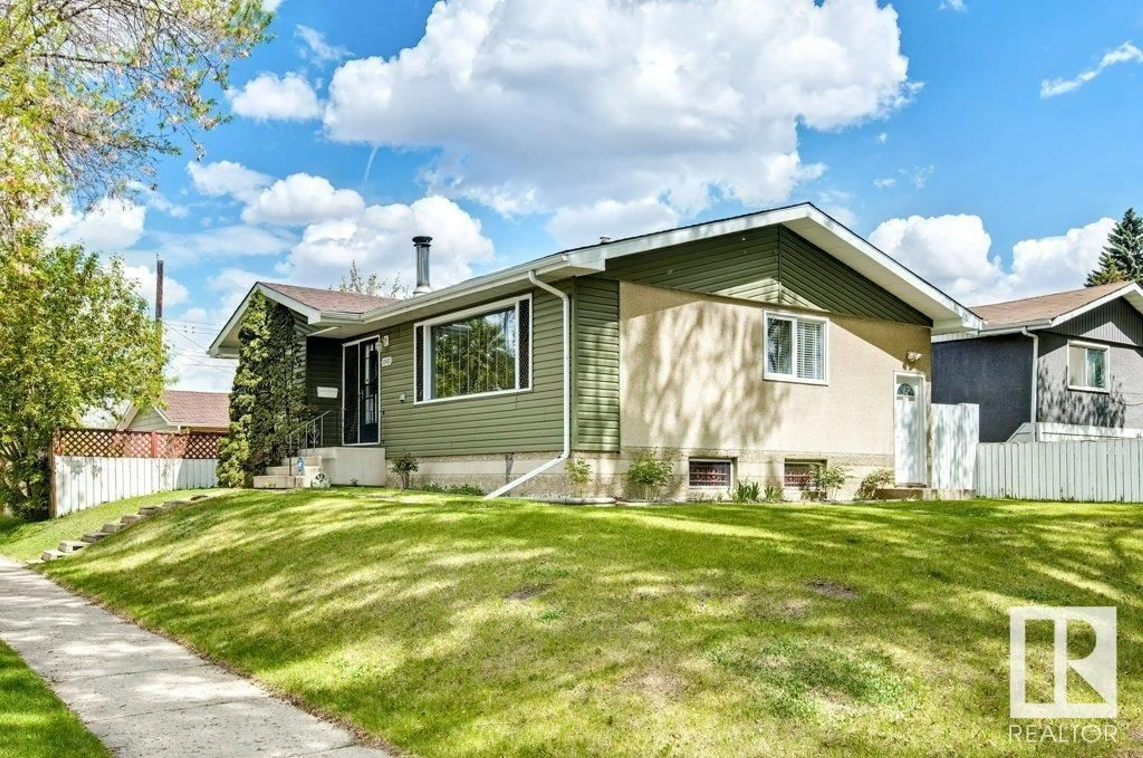 Home with vinyl exterior material, street for 11503 42 ST, Edmonton Alberta T5W2N1