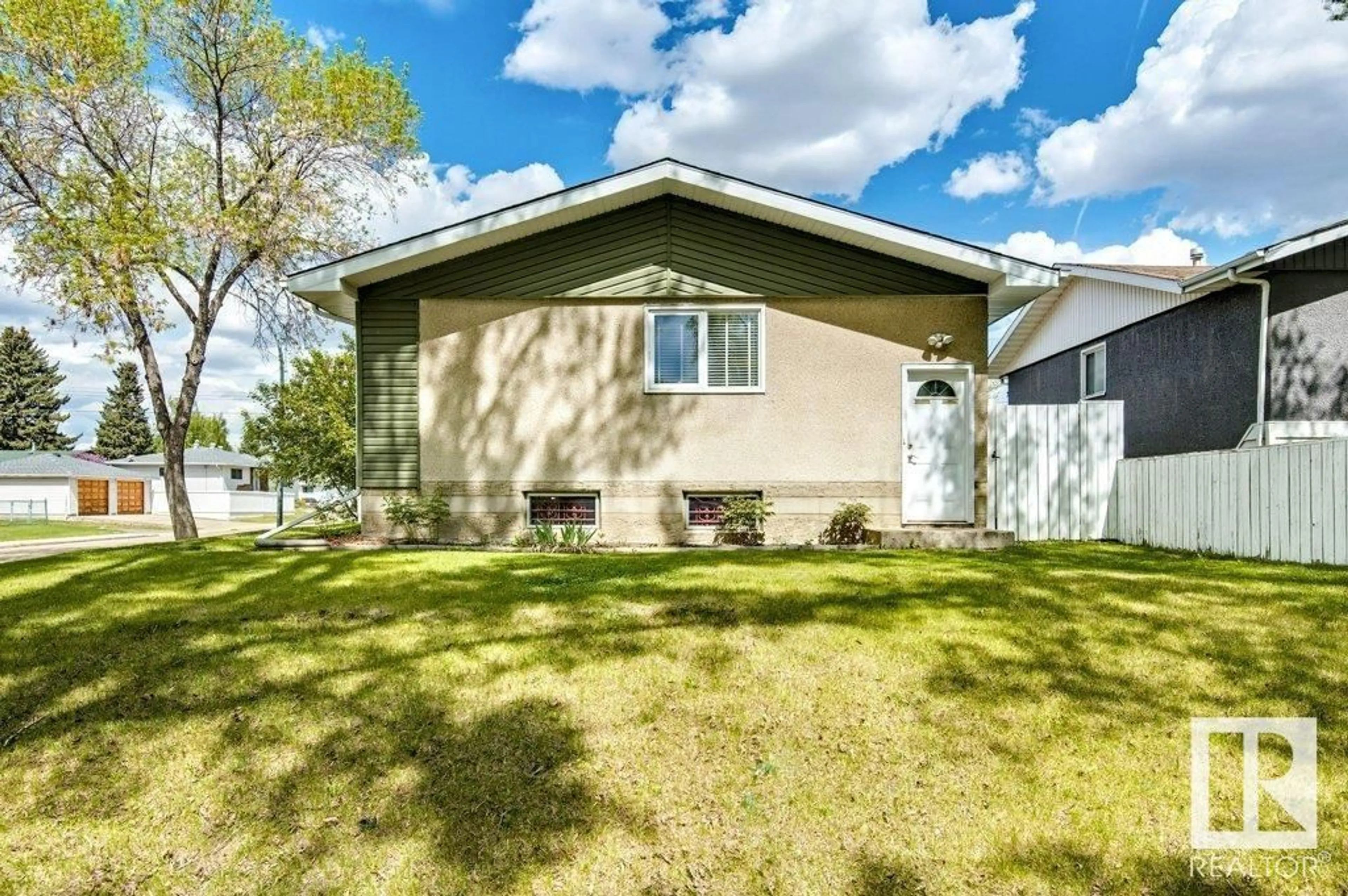 Home with vinyl exterior material, street for 11503 42 ST, Edmonton Alberta T5W2N1