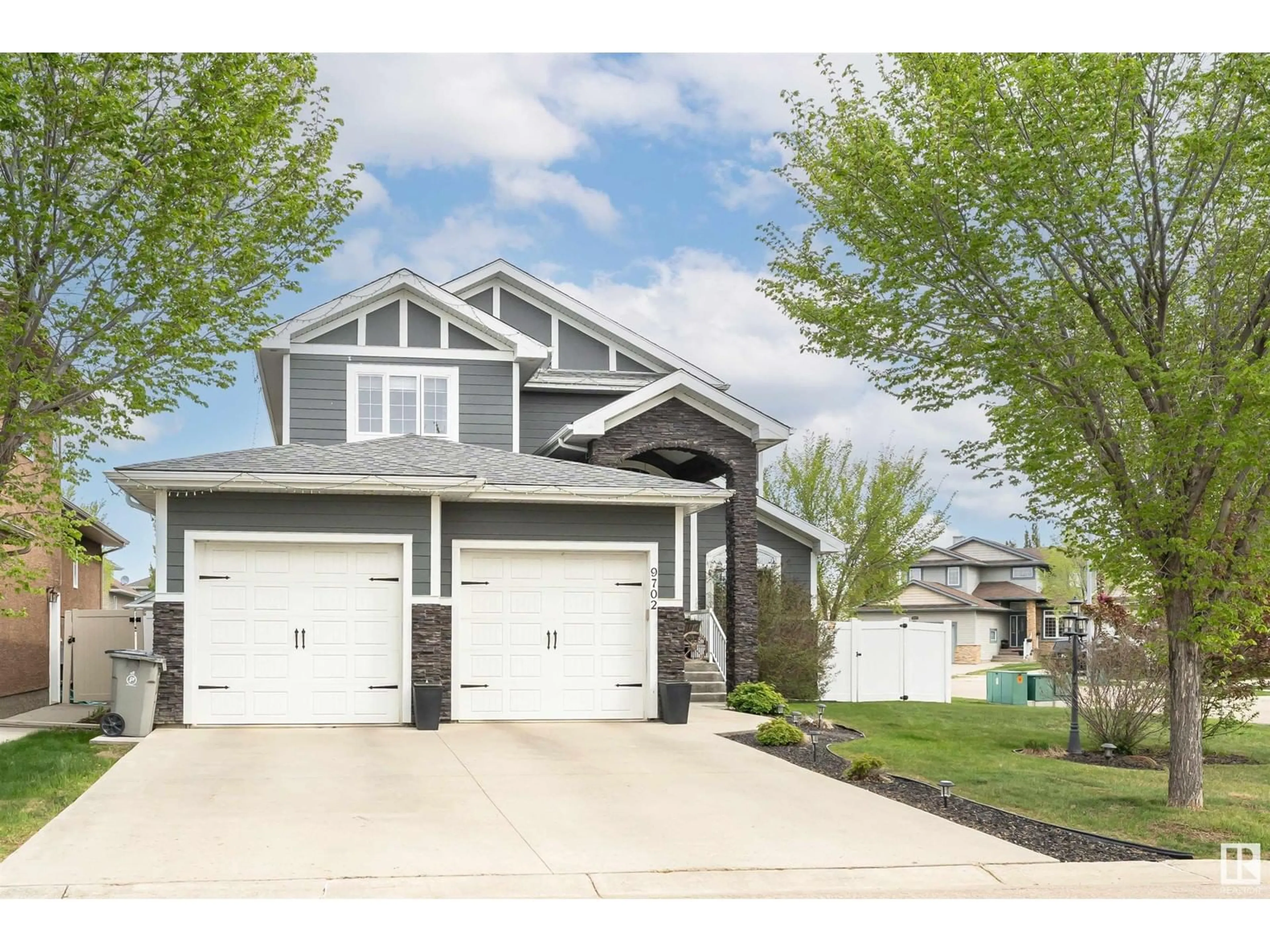 Home with vinyl exterior material, street for 9702 101A AV, Morinville Alberta T8R0C8