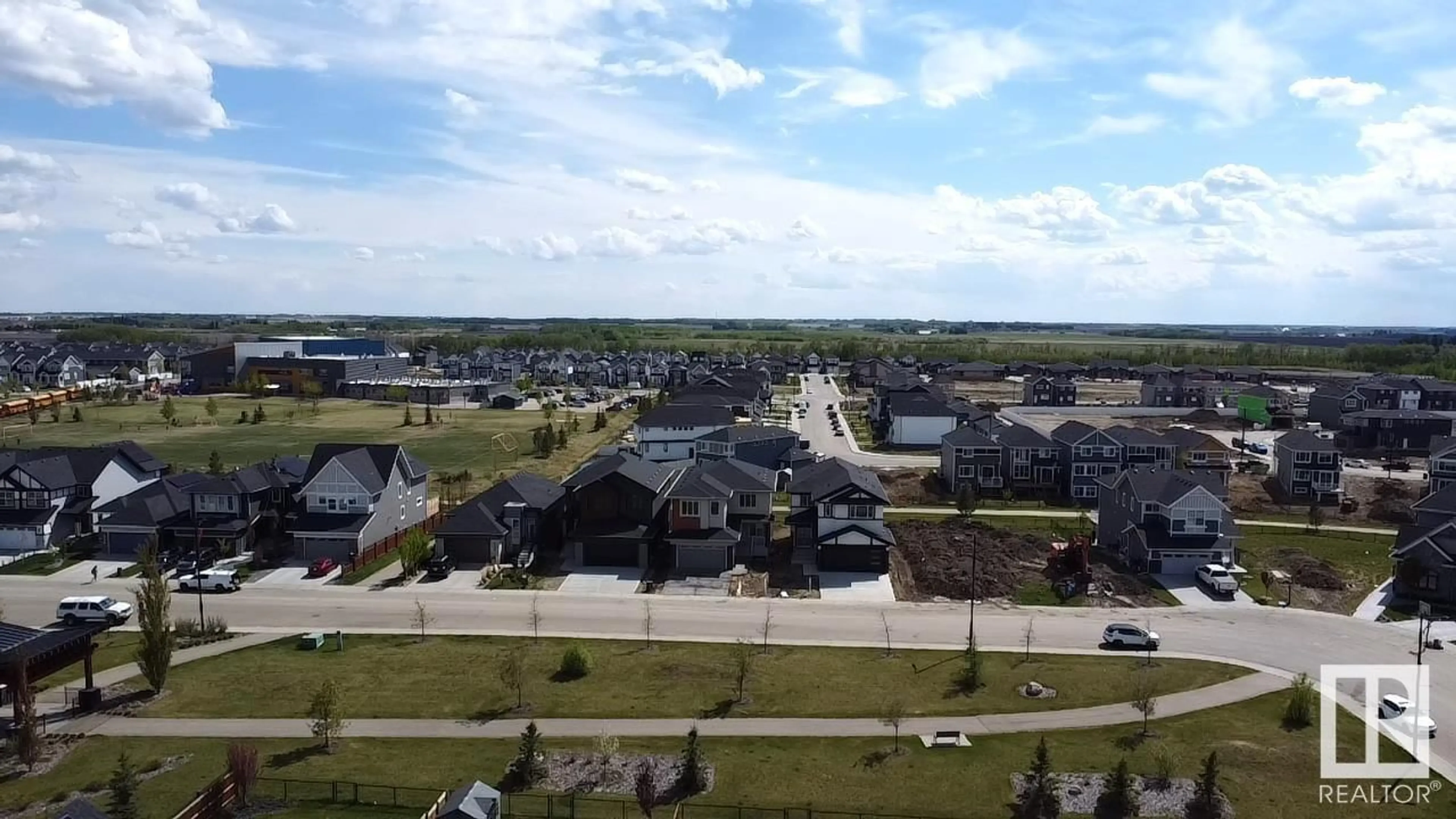 A pic from outside/outdoor area/front of a property/back of a property/a pic from drone, water/lake/river/ocean view for 165 EDGEWATER CIR, Leduc Alberta T9E1K5