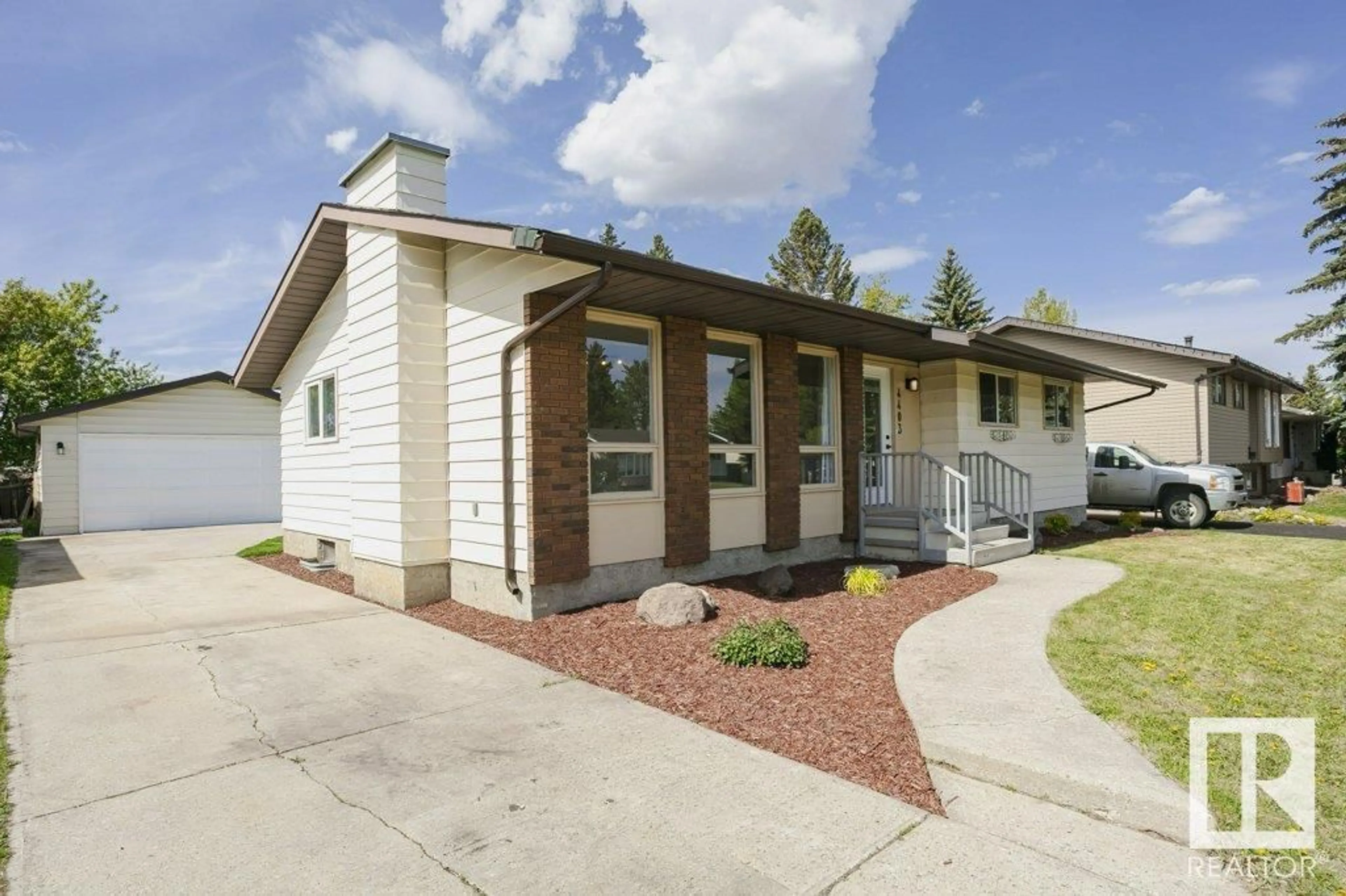 Home with vinyl exterior material, street for 4403 54 AV, Beaumont Alberta T4X1J6