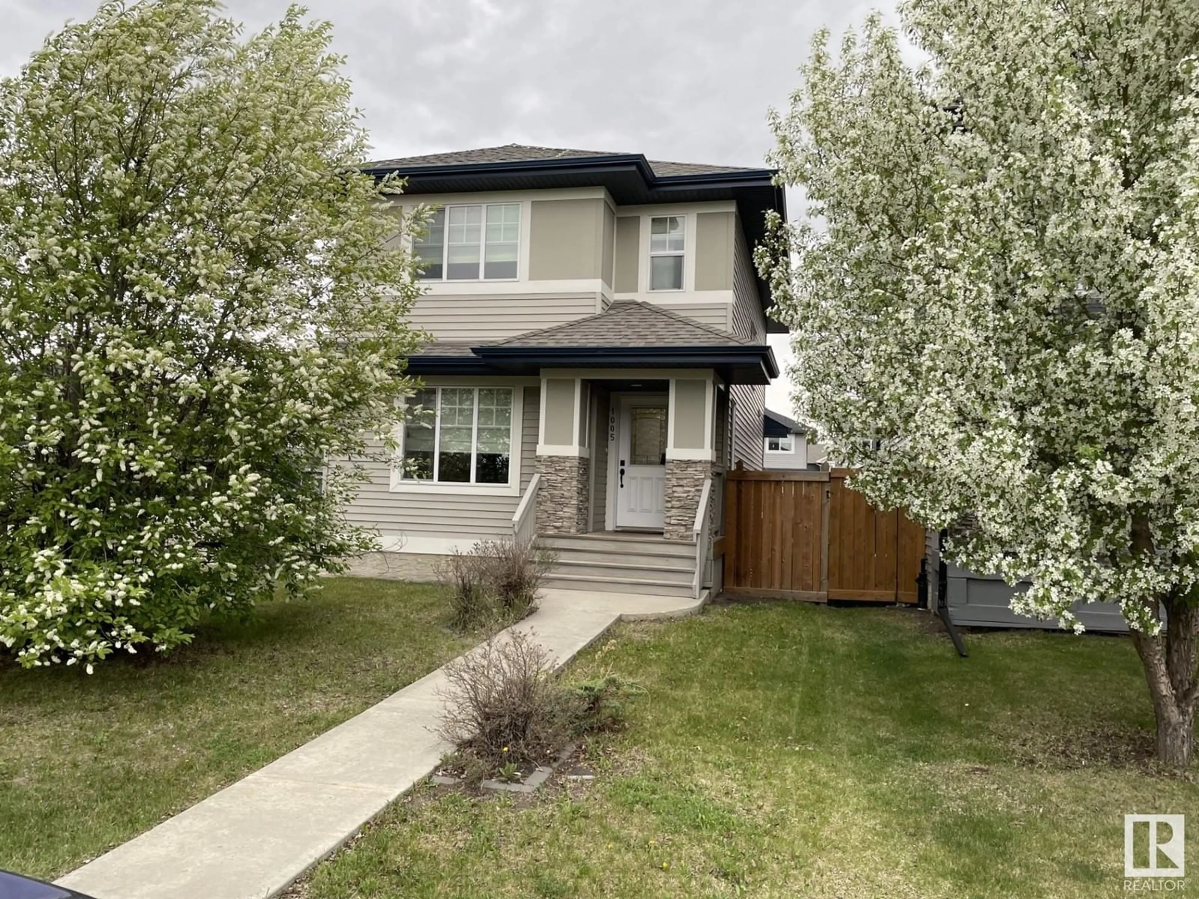 Home with vinyl exterior material, street for SW - 1005 177A ST, Edmonton Alberta T6W2A1