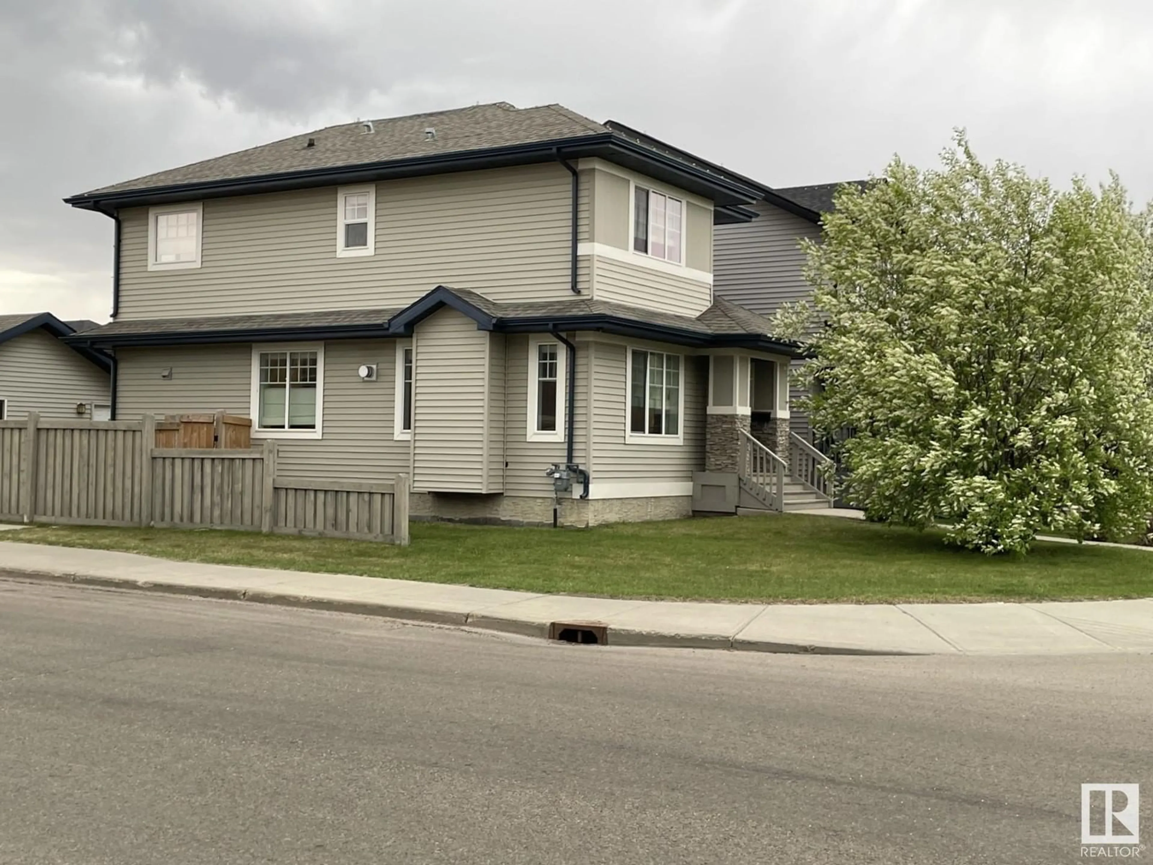 Home with vinyl exterior material, street for SW - 1005 177A ST, Edmonton Alberta T6W2A1