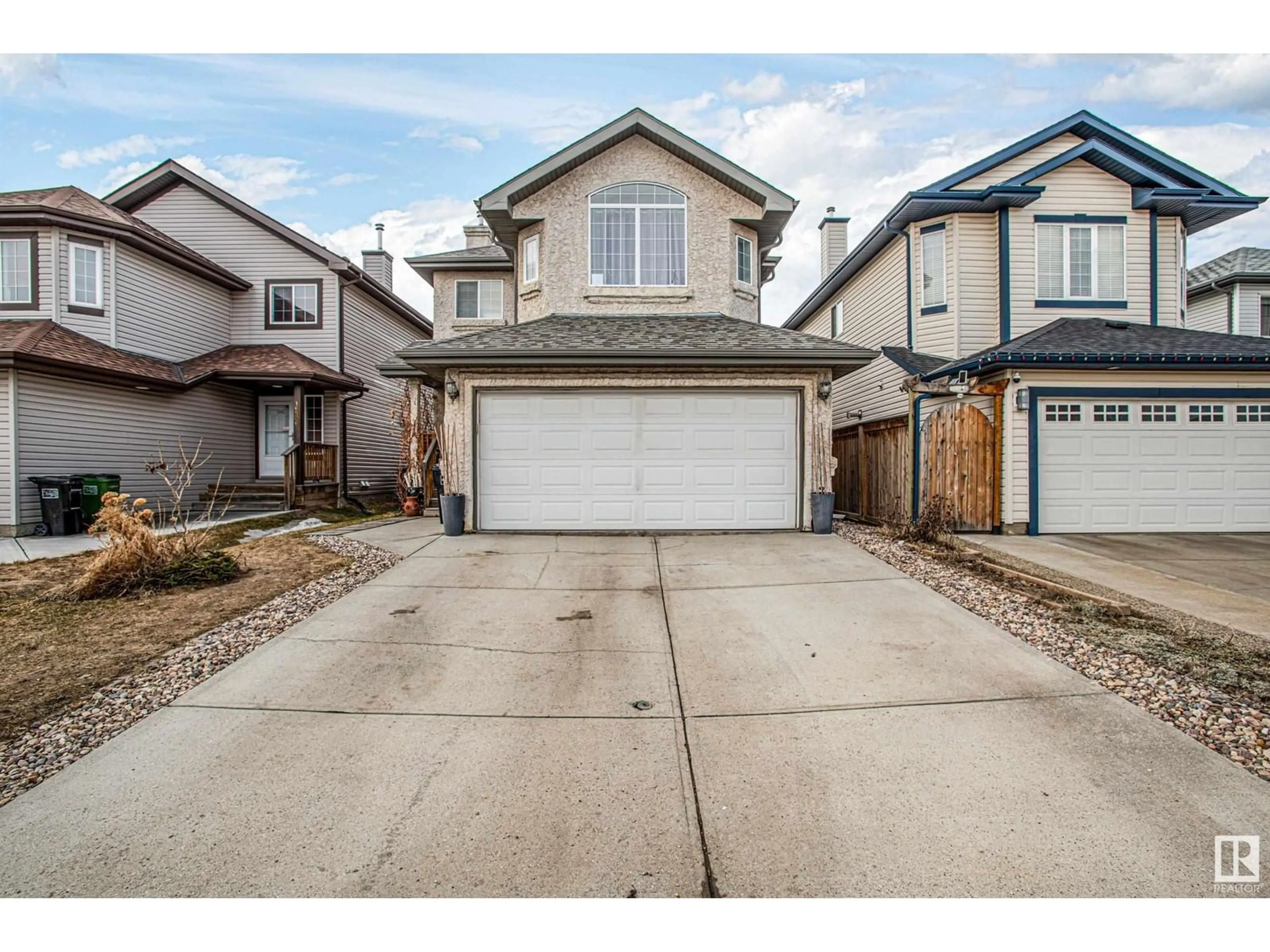Home with vinyl exterior material, street for 16508 56 ST, Edmonton Alberta T5Y3M7
