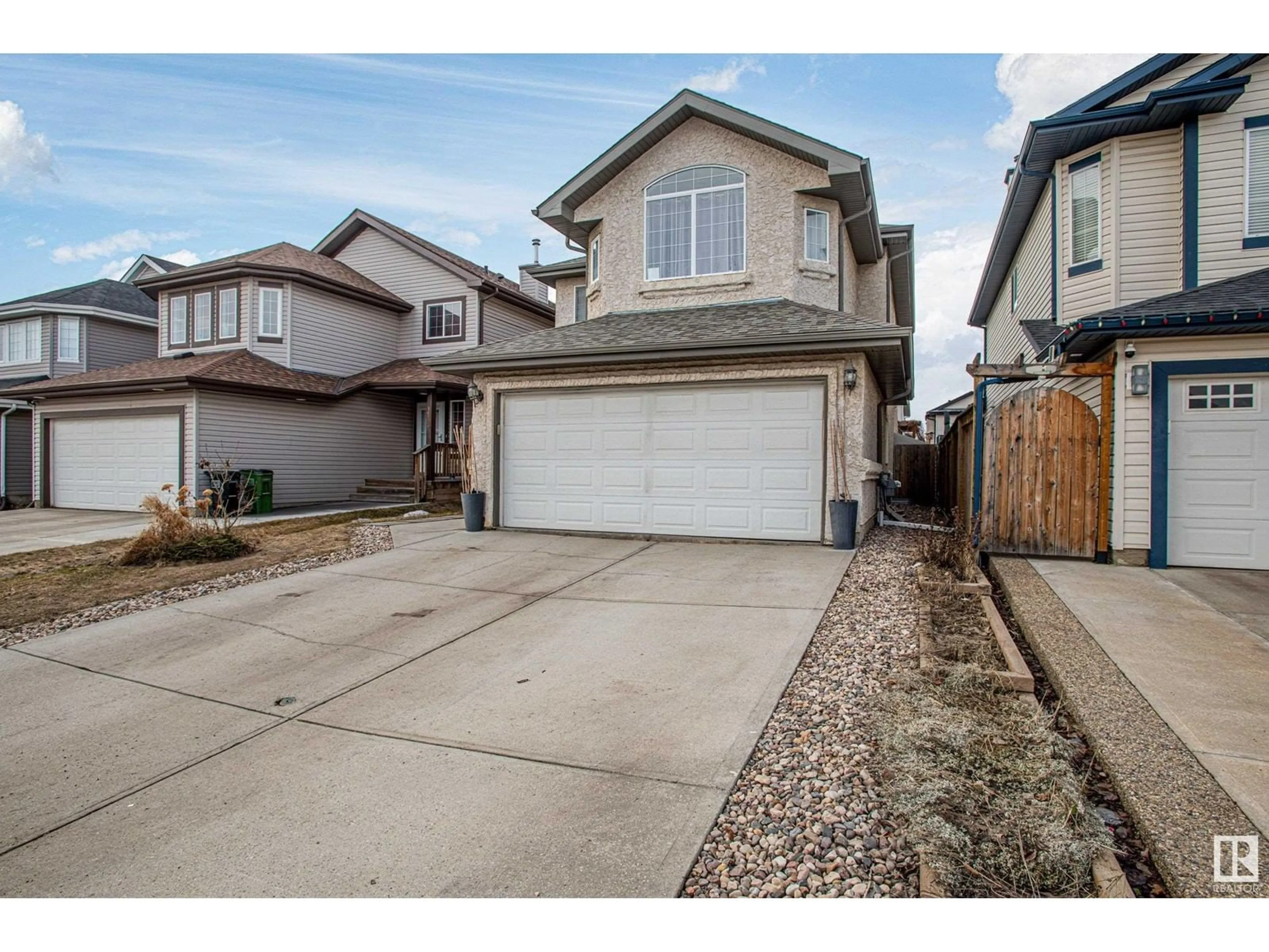 Home with vinyl exterior material, street for 16508 56 ST, Edmonton Alberta T5Y3M7