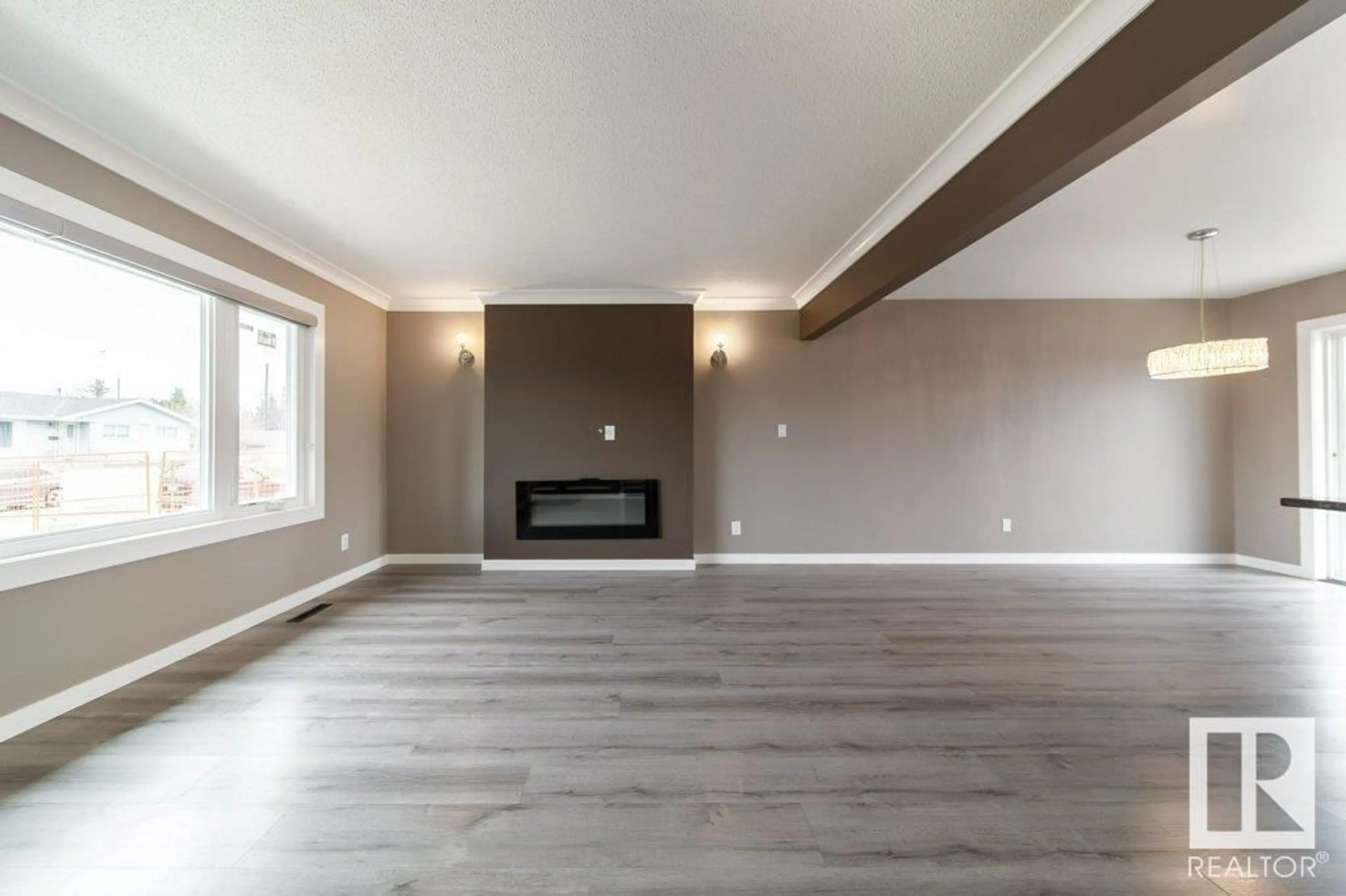 Living room with furniture, wood/laminate floor for 7723 132A AVENUE AVENUE, Edmonton Alberta T5C2C4