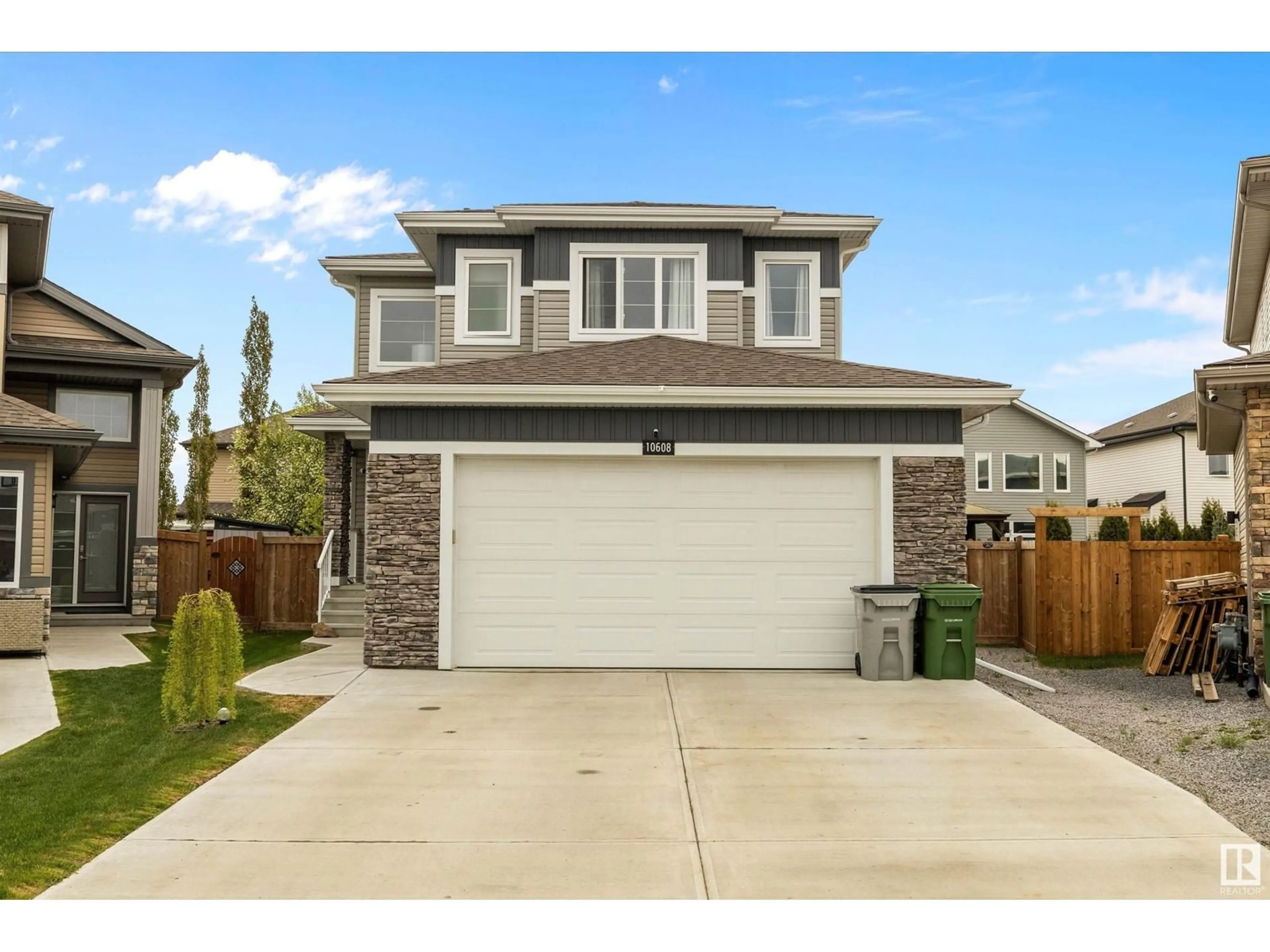 Home with vinyl exterior material, street for 10608 96A ST, Morinville Alberta T8R0E8