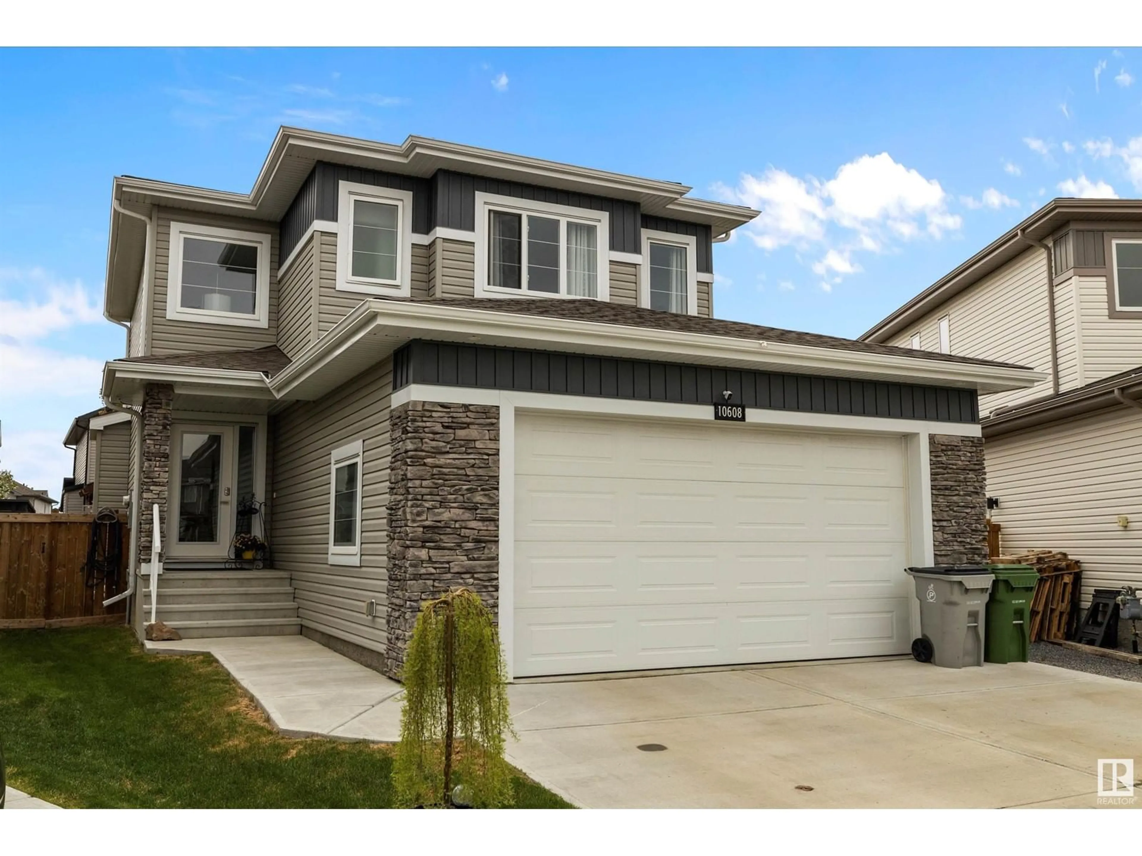 Home with vinyl exterior material, street for 10608 96A ST, Morinville Alberta T8R0E8