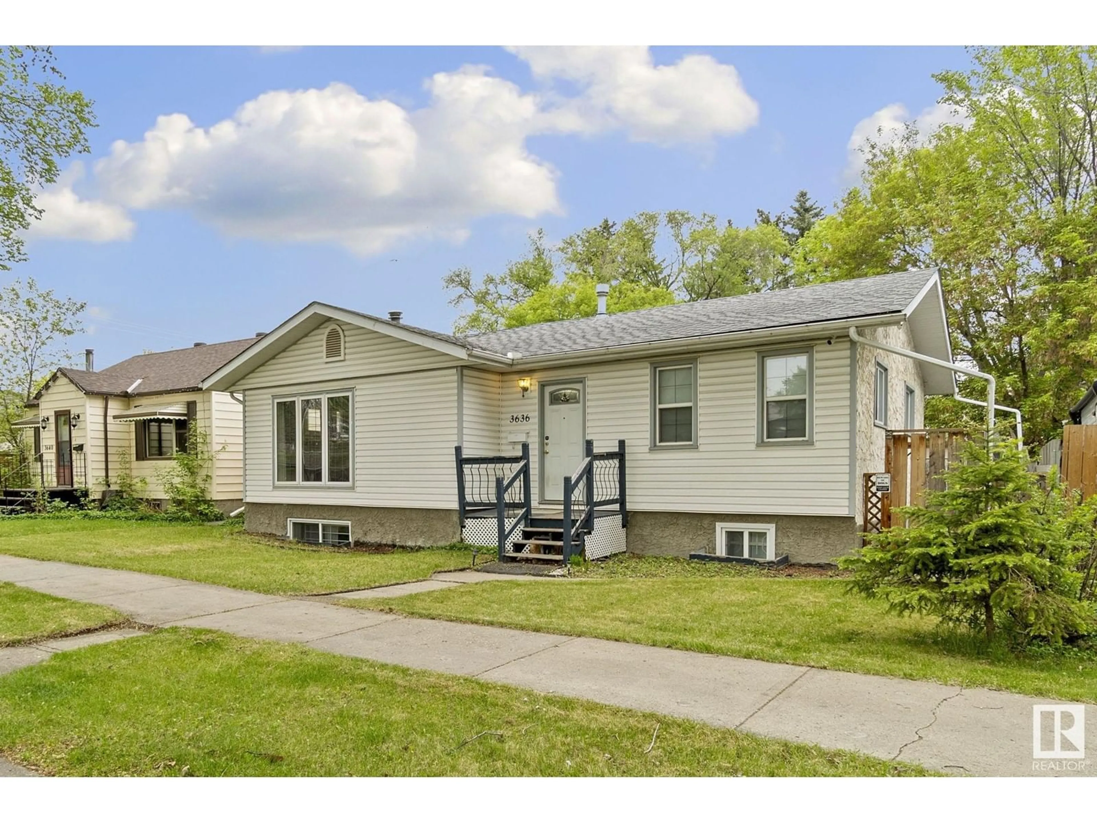 Home with vinyl exterior material, street for NW - 3636 116 AV, Edmonton Alberta T5W0E6