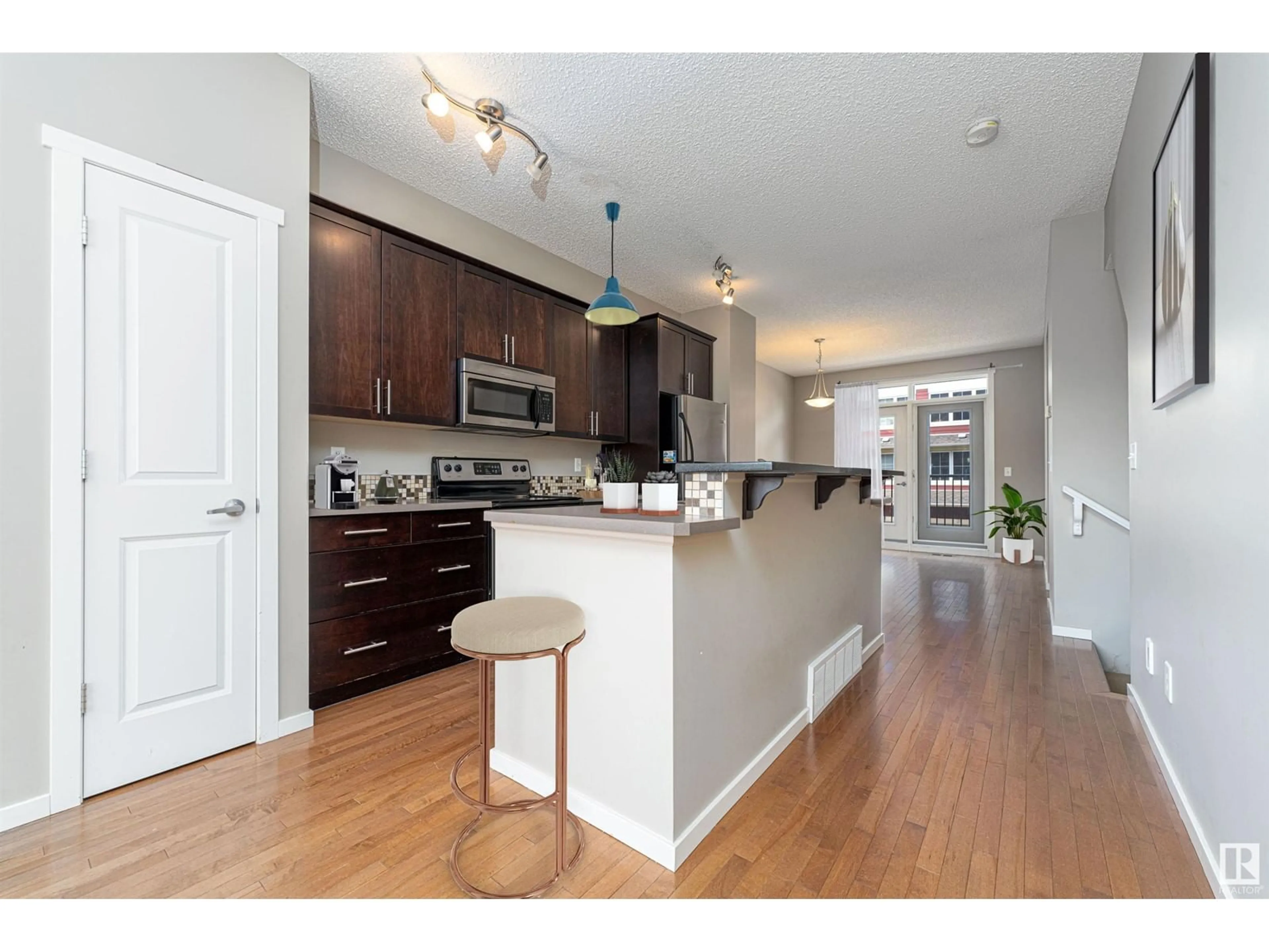 Open concept kitchen, wood/laminate floor for 603 - 30 WATT BV, Edmonton Alberta T6X0P3
