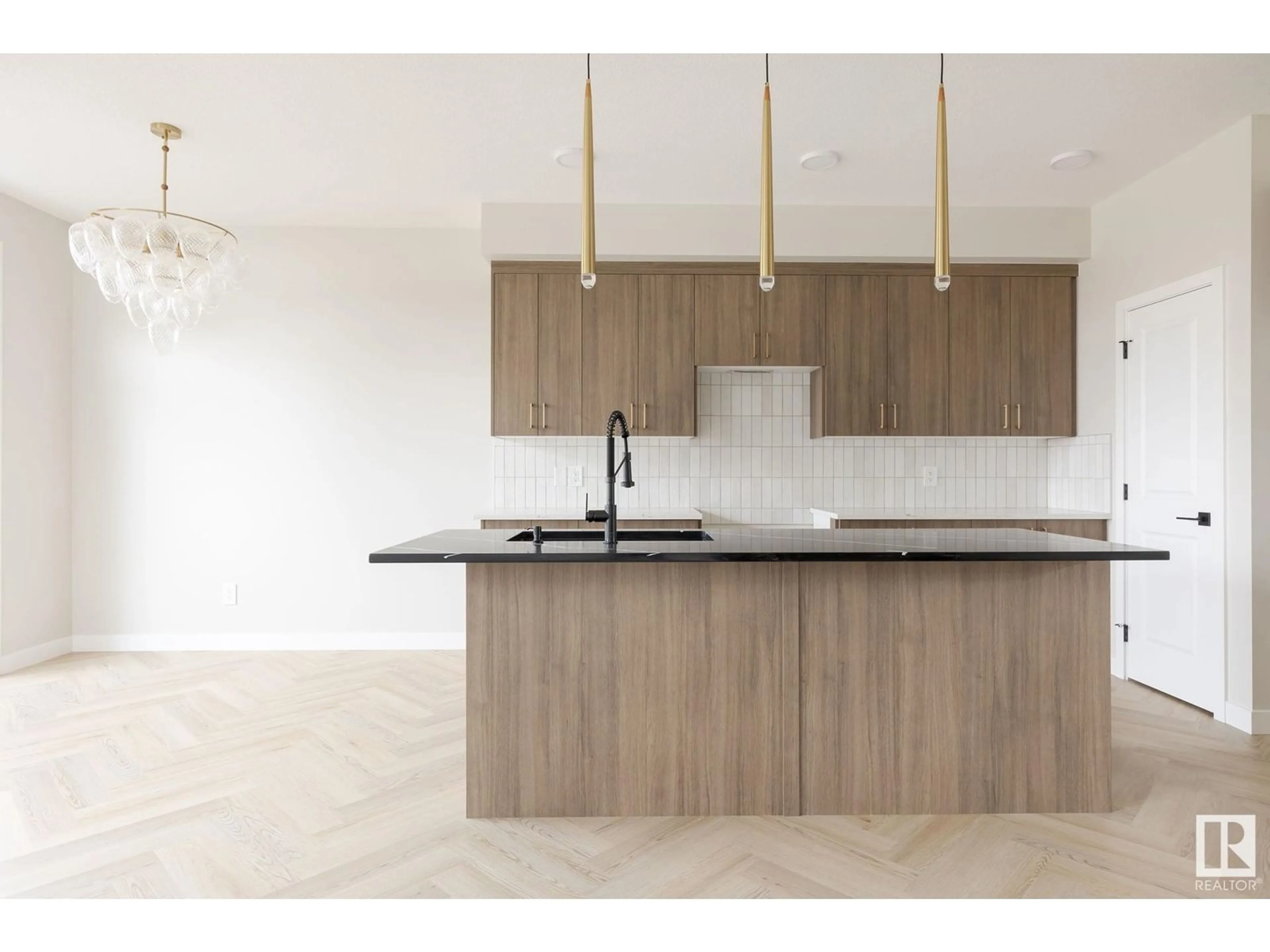 Open concept kitchen, wood/laminate floor for SW - 8230 KIRIAK LO, Edmonton Alberta T6W4R4