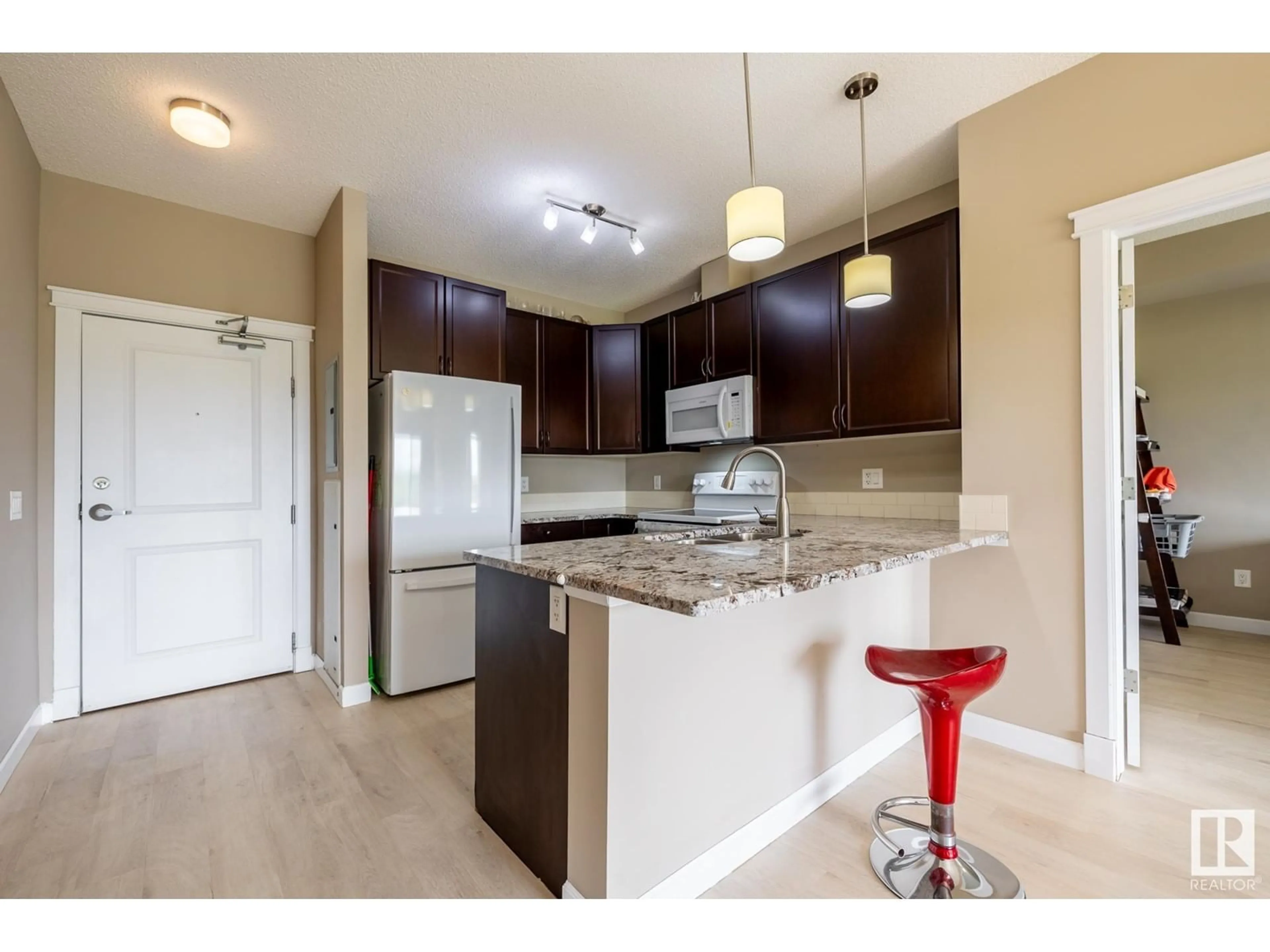 Open concept kitchen, unknown for #413 - 3715 WHITELAW LN, Edmonton Alberta T6W2C3