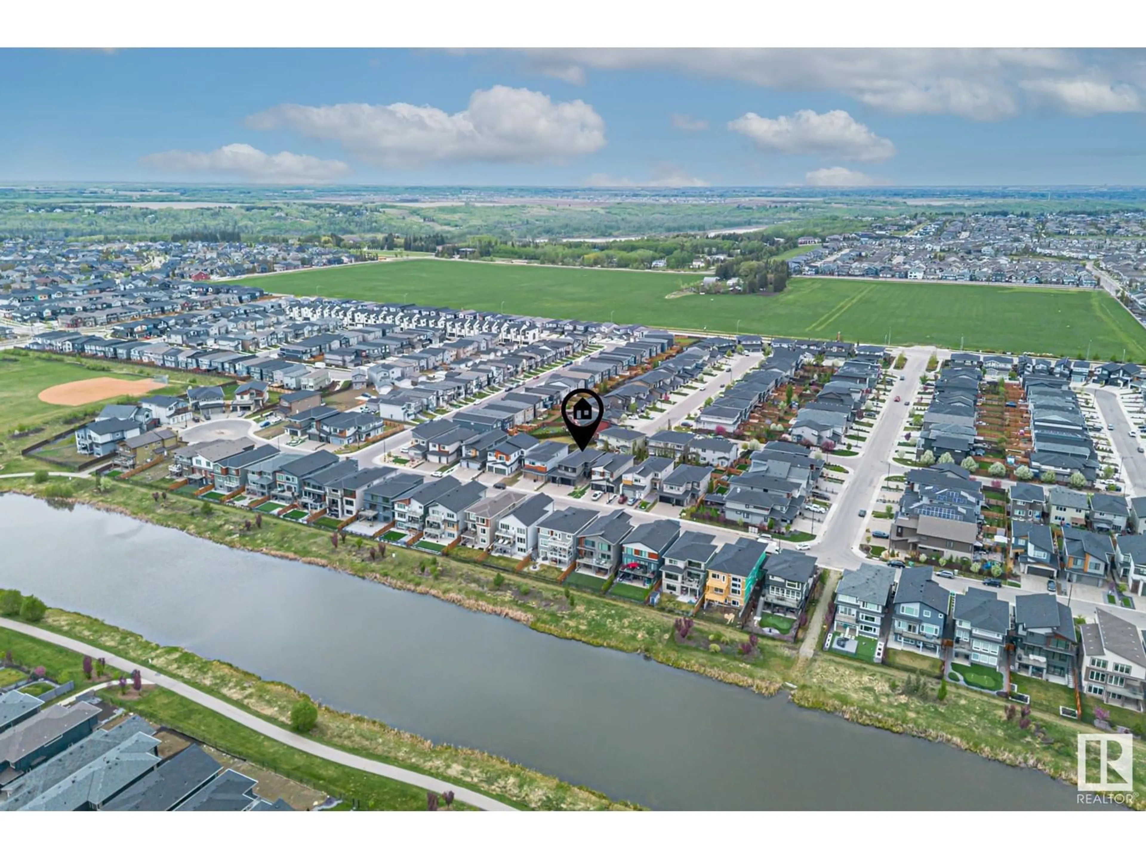 A pic from outside/outdoor area/front of a property/back of a property/a pic from drone, water/lake/river/ocean view for SW - 3116 KOSTASH GREEN GR, Edmonton Alberta T6W4K3