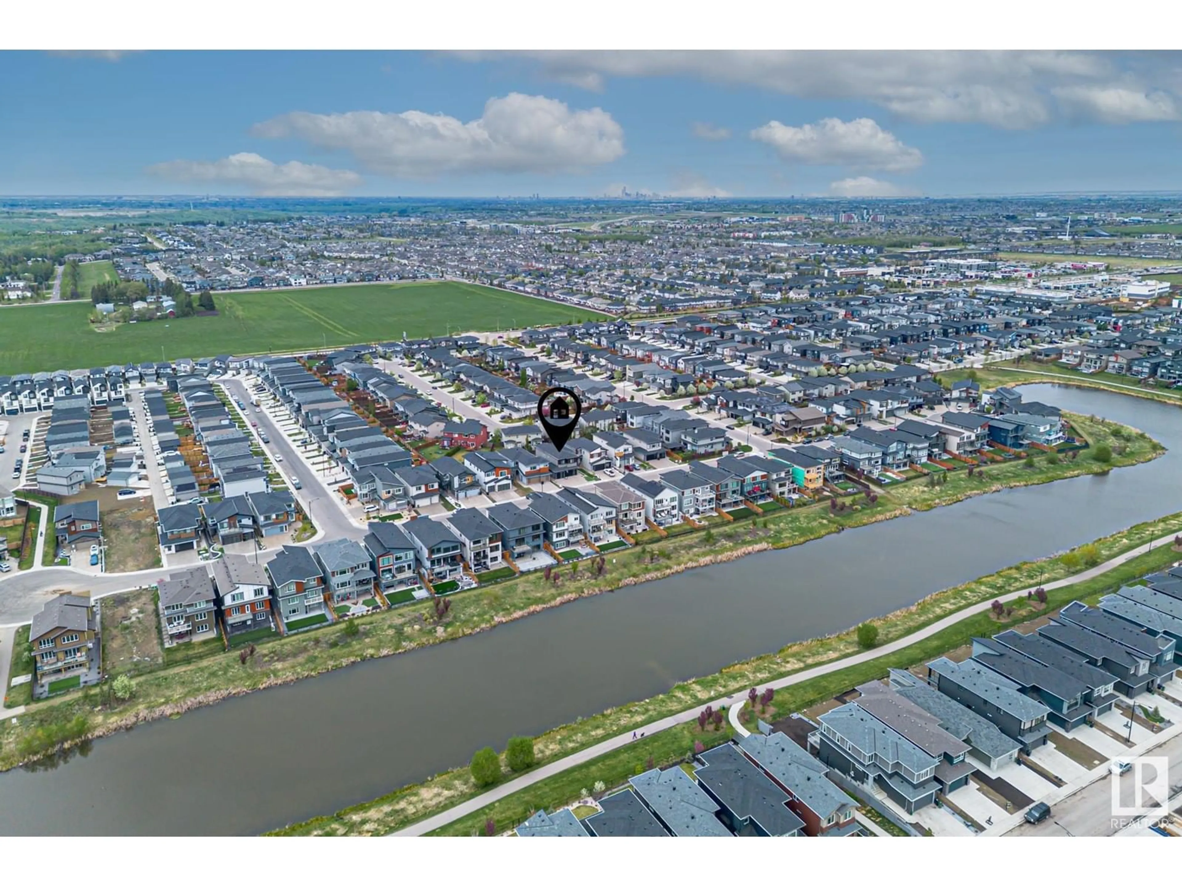 A pic from outside/outdoor area/front of a property/back of a property/a pic from drone, water/lake/river/ocean view for SW - 3116 KOSTASH GREEN GR, Edmonton Alberta T6W4K3