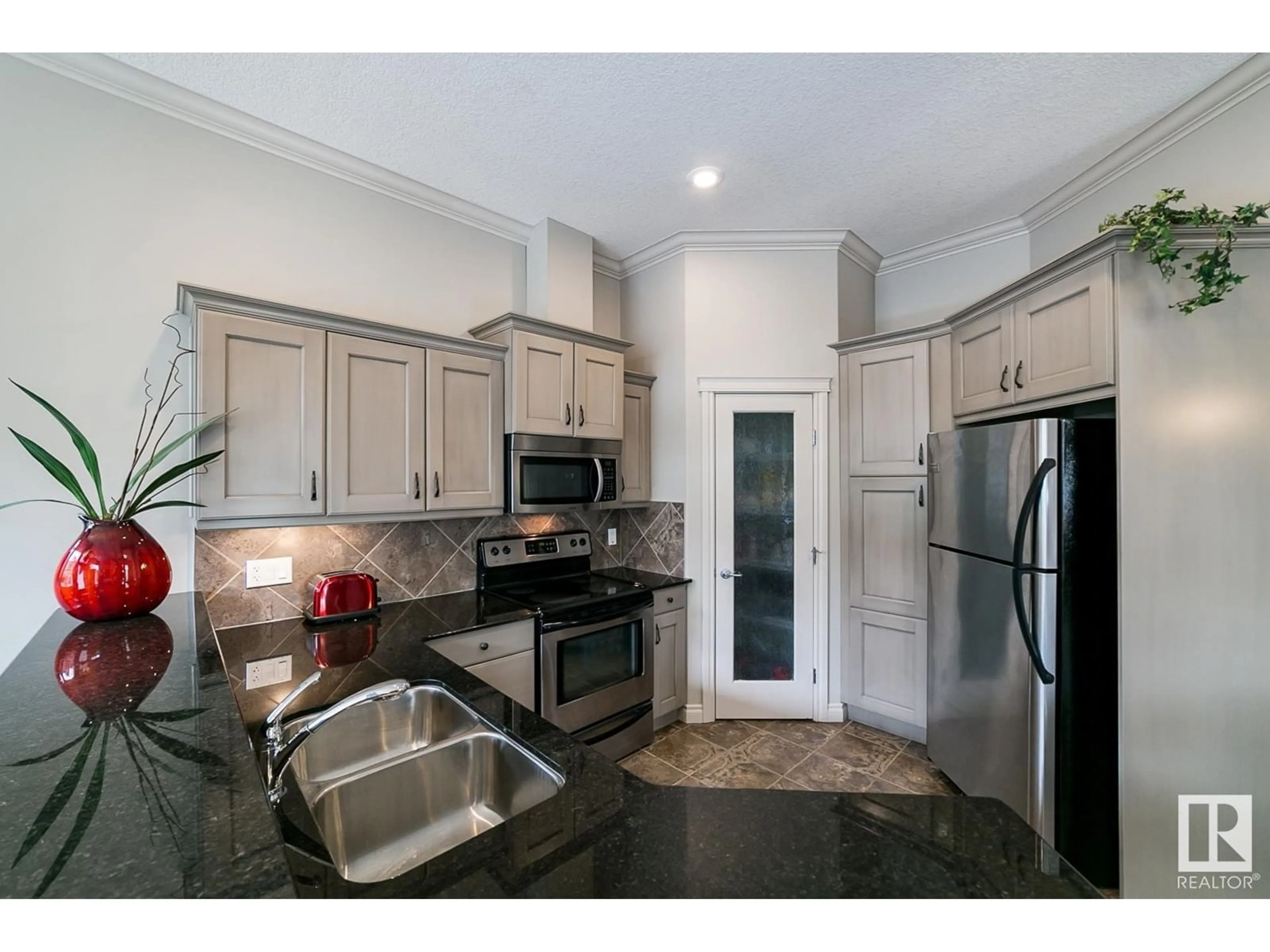 Open concept kitchen, ceramic/tile floor for 12610 15 AV SW, Edmonton Alberta T6W1X1
