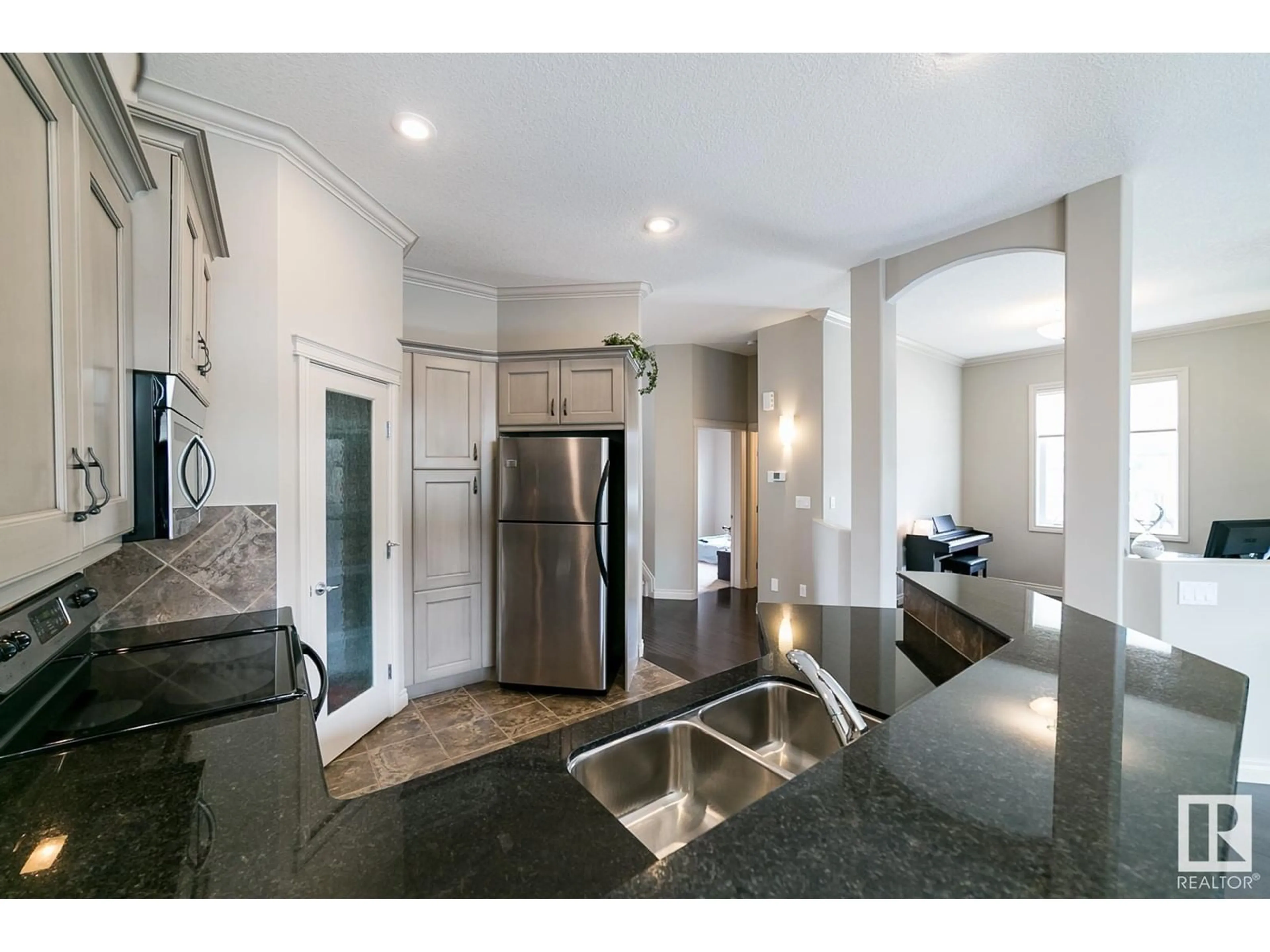 Open concept kitchen, ceramic/tile floor for 12610 15 AV SW, Edmonton Alberta T6W1X1