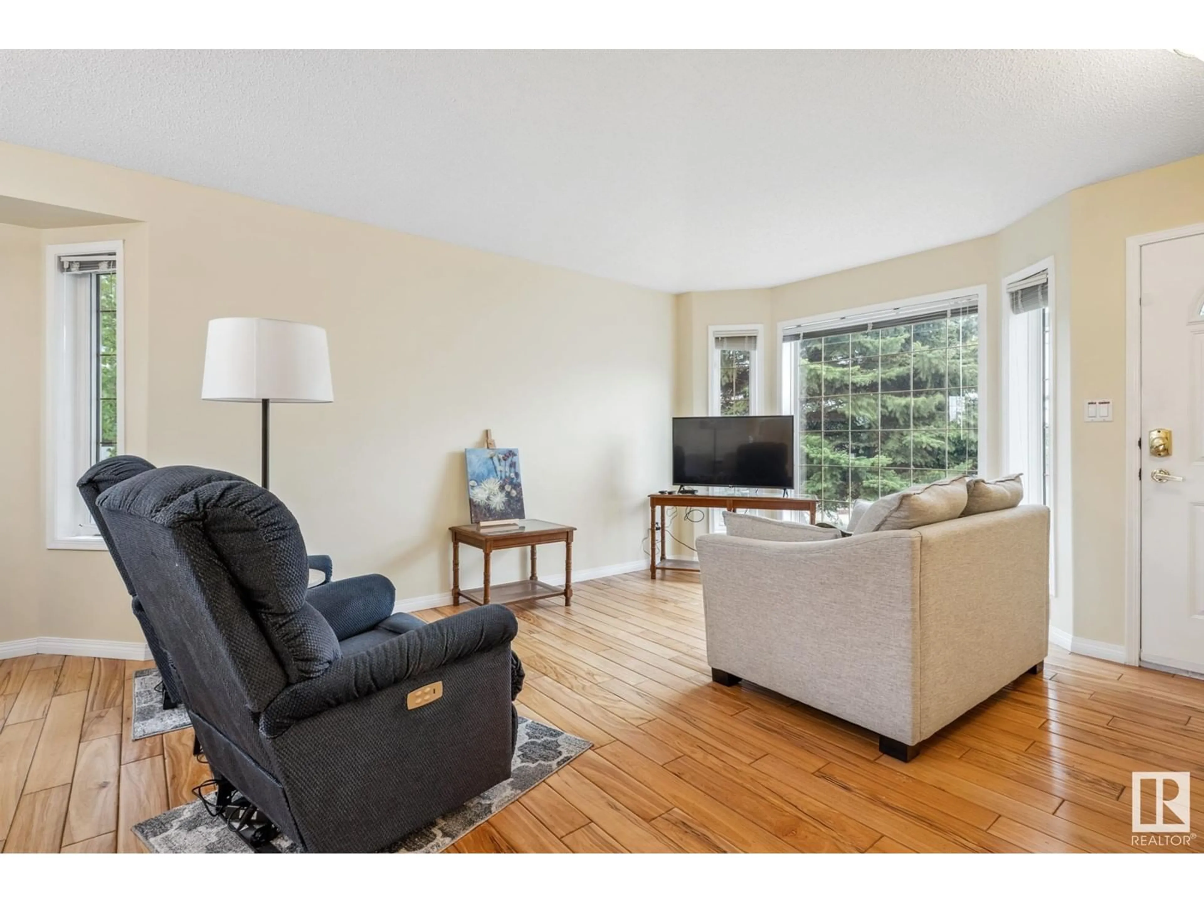 Living room with furniture, wood/laminate floor for 7 - 39 CRANFORD WY, Sherwood Park Alberta T8H5W5