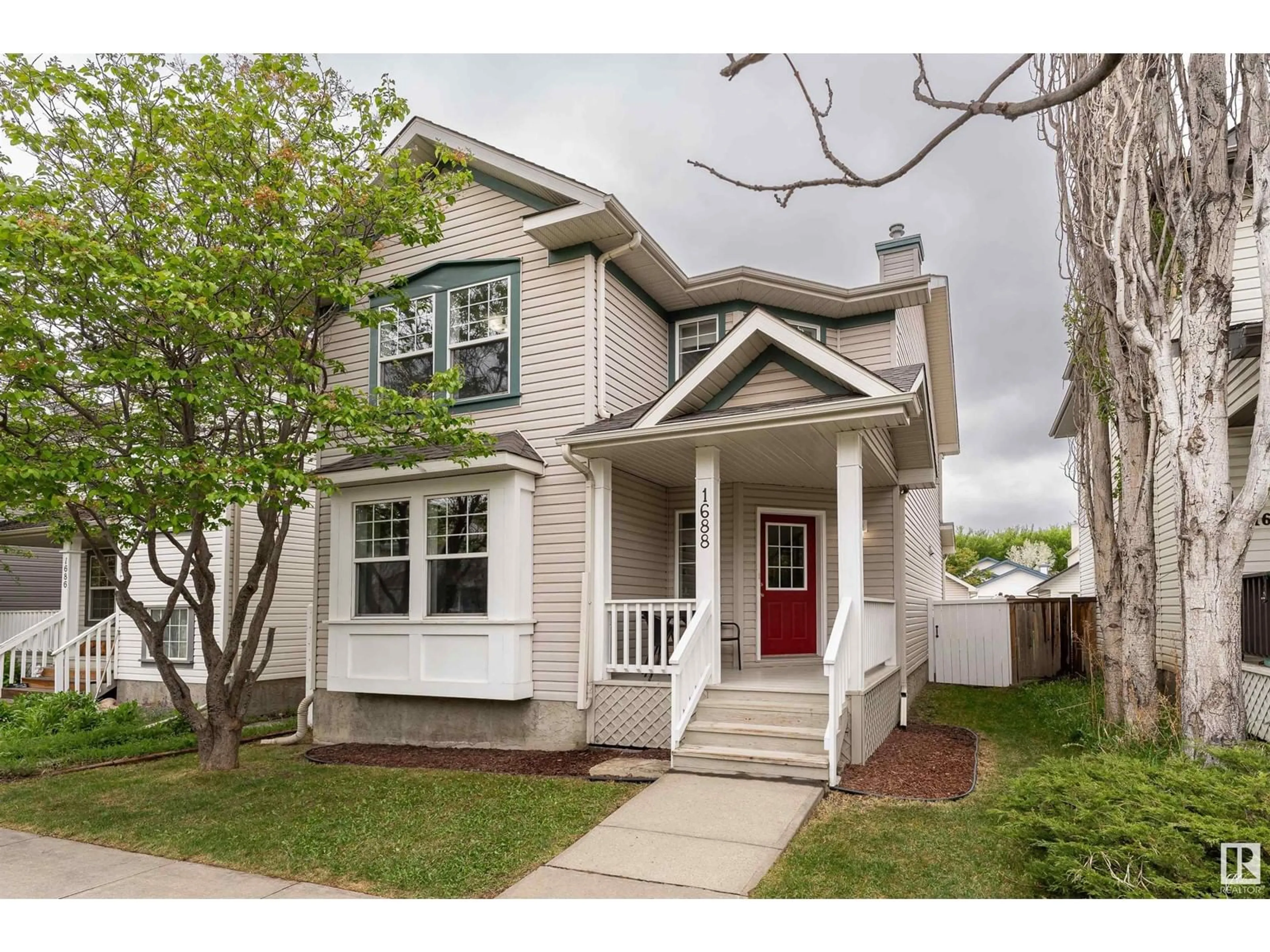 Home with vinyl exterior material, street for 1688 TOMPKINS WD, Edmonton Alberta T6R2Y4