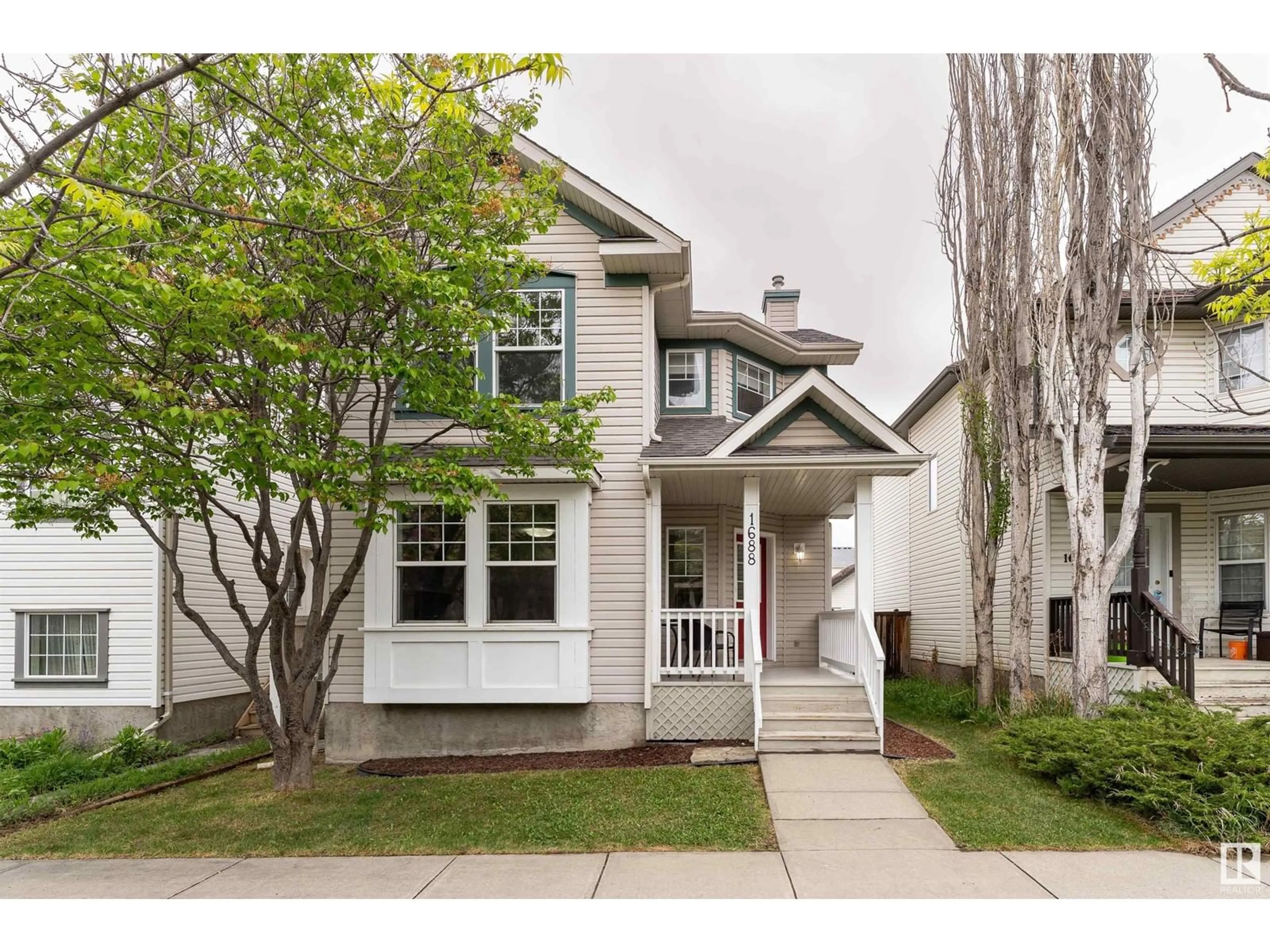 Home with vinyl exterior material, street for 1688 TOMPKINS WD, Edmonton Alberta T6R2Y4